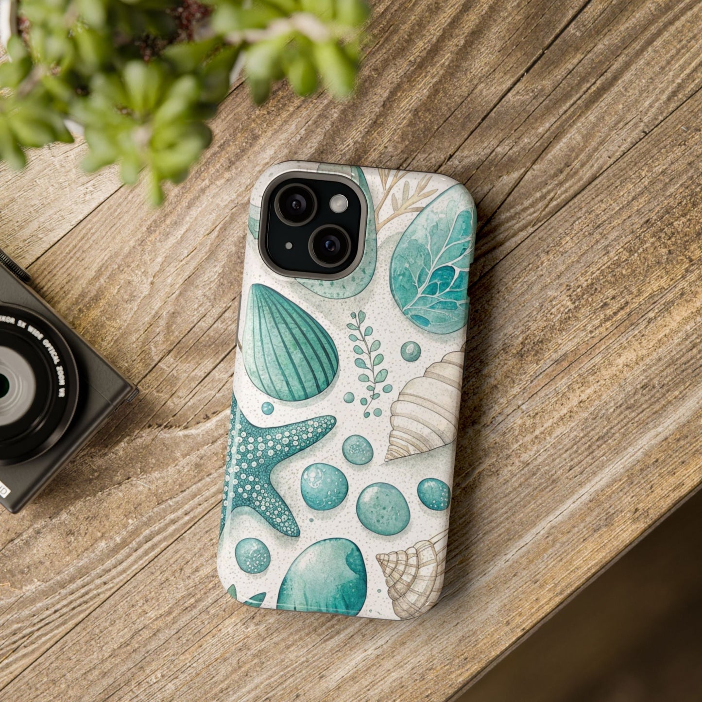 Celebration Sea iPhone Tough Case with sea shell and starfish design on wooden surface