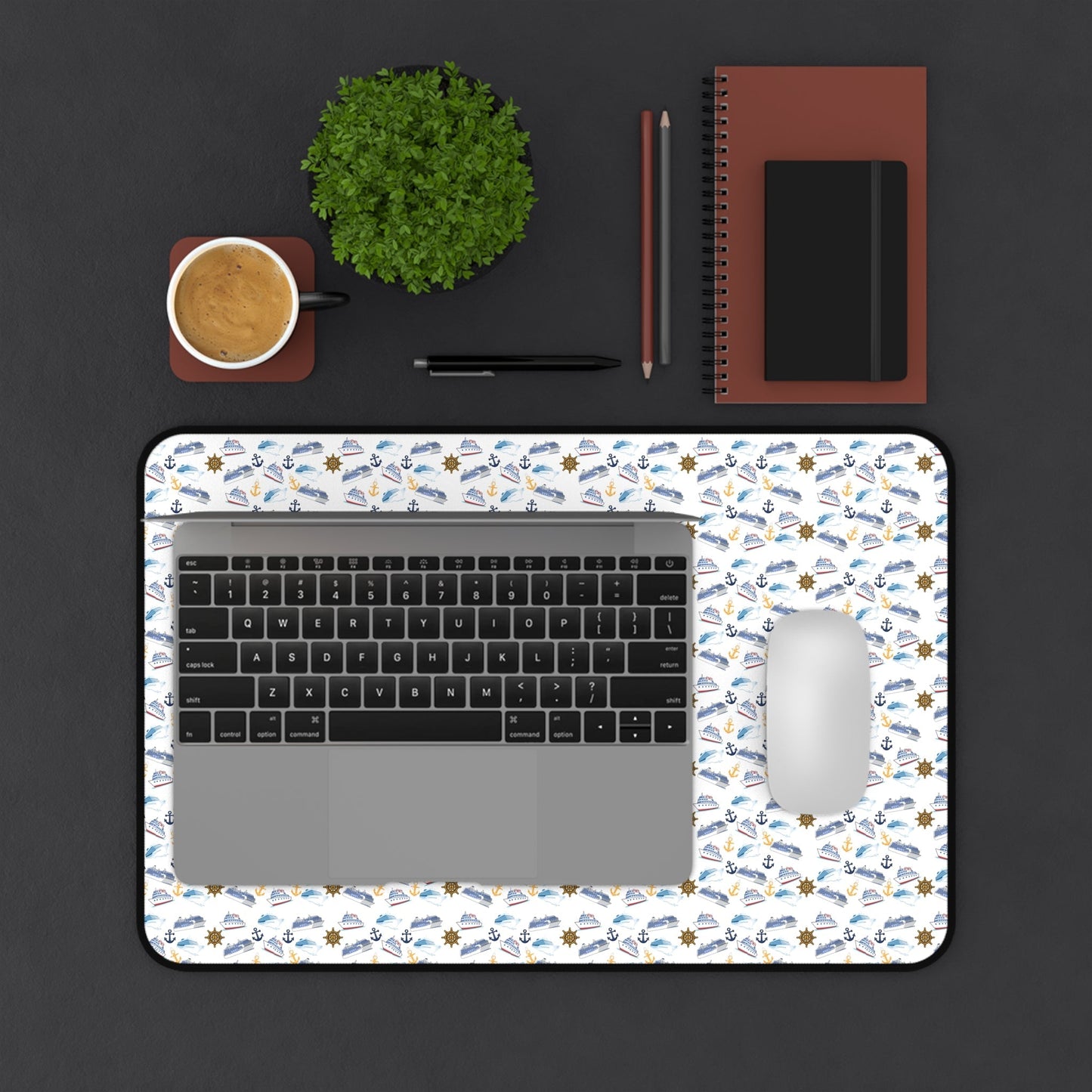 Cruise Ship Inspired Desk Mat with nautical pattern, laptop, and mouse on black desk surface
