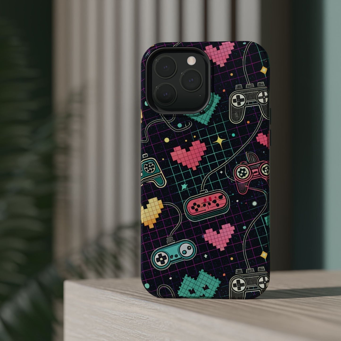 Retro gamer inspired iPhone case with colorful pixelated hearts and classic game controllers design, durable dual-layer protection with MagSafe compatibility.