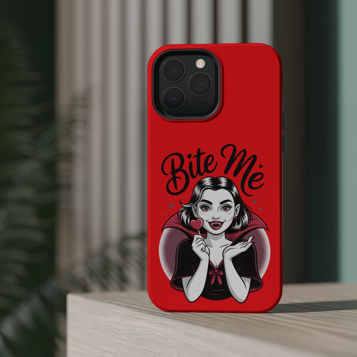 Halloween Vampire iPhone case with red background and "Bite Me" text featuring a cartoon vampire girl illustration