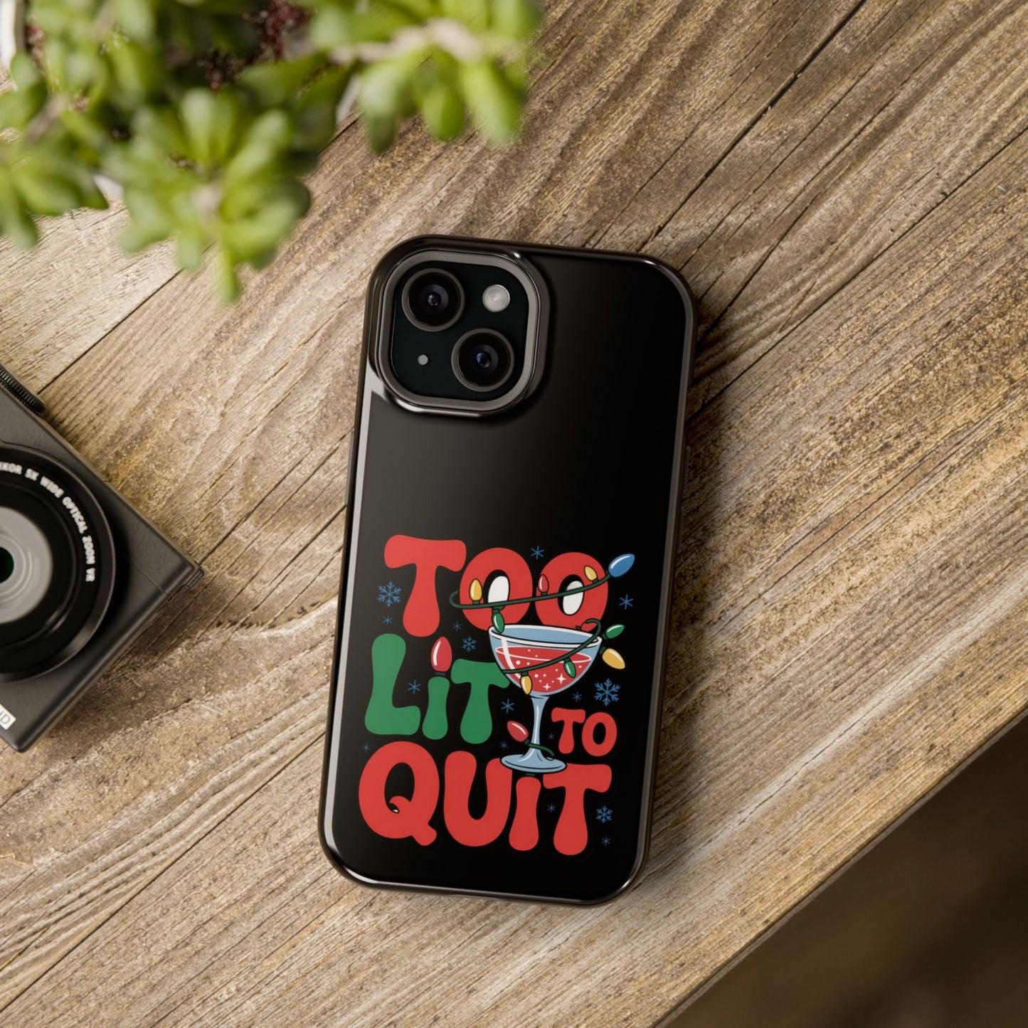 Holiday themed iPhone case with "Too Lit to Quit" festive design and colorful holiday graphics