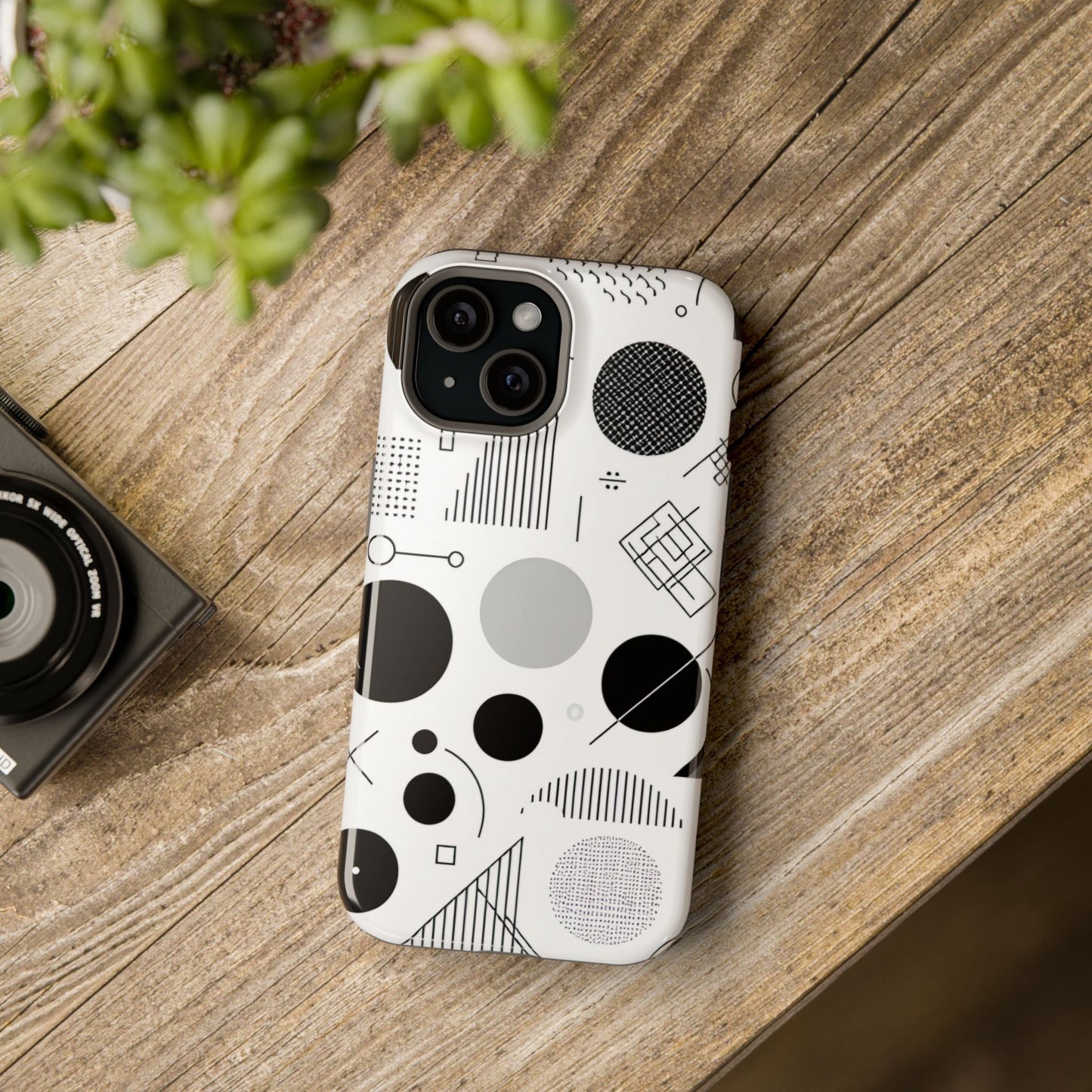 iPhone case with black and white abstract art geometric design on wood surface