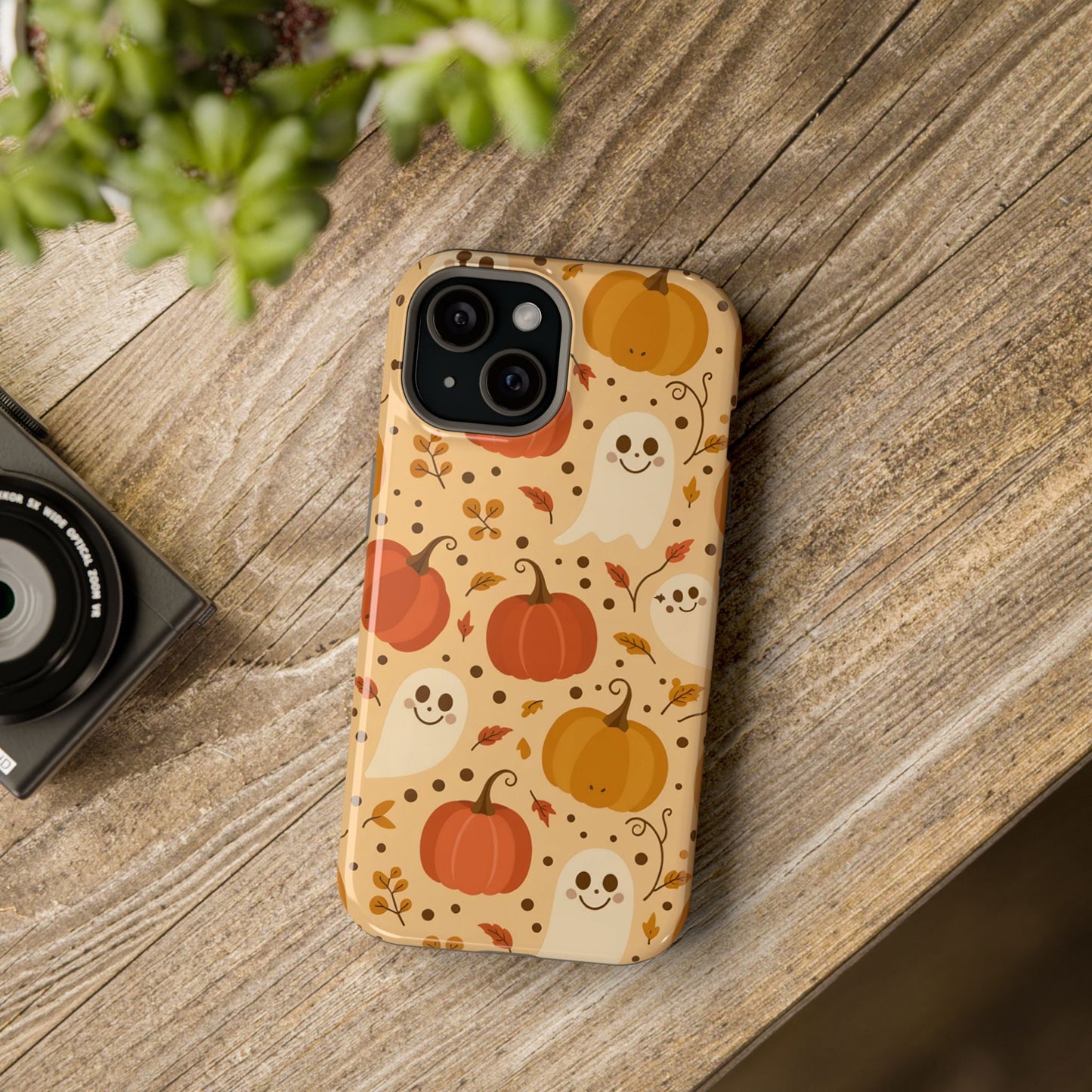 Spooky Pumpkins iPhone case with Halloween ghosts and pumpkins design on wooden background