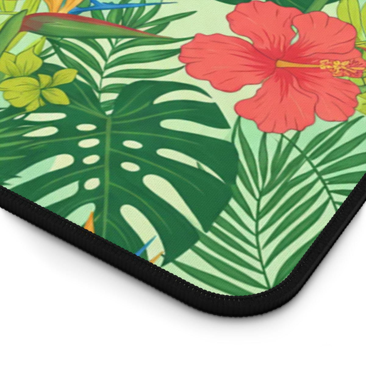 Tropical hibiscus and bird of paradise flowers on a light green patterned background.