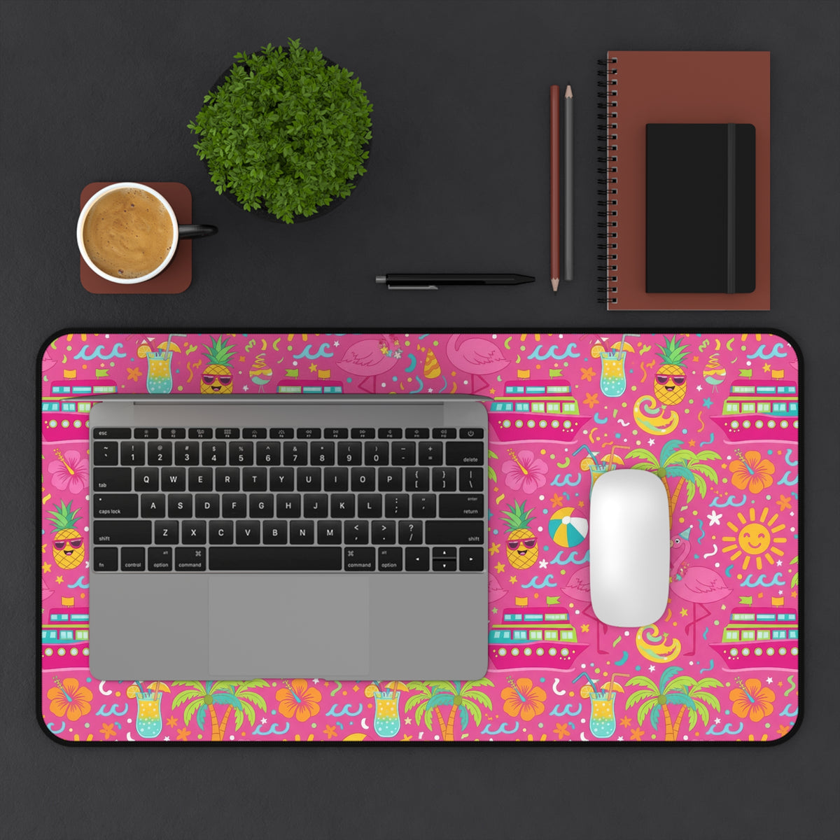 Desk mat with a pink tropical vacation pattern featuring cruises, flamingos, pineapples, and cocktails.