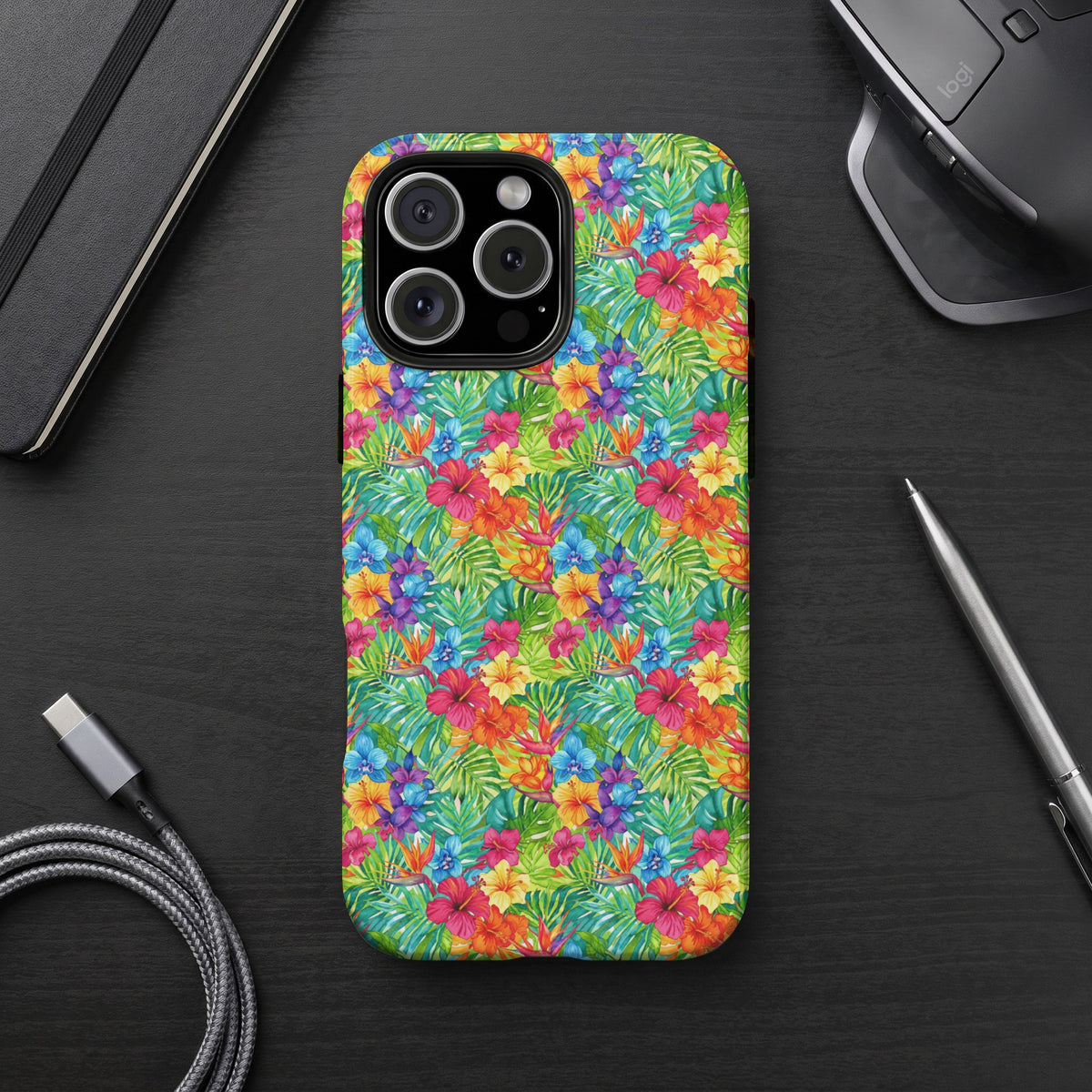 iPhone case with a colorful tropical floral and leaf pattern.