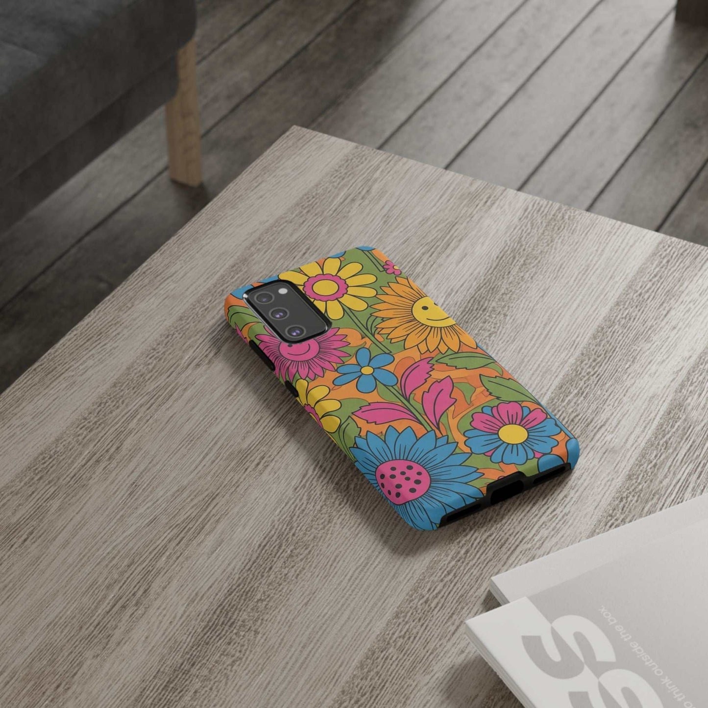 Samsung Phone Case with retro colorful flower power design on wooden table