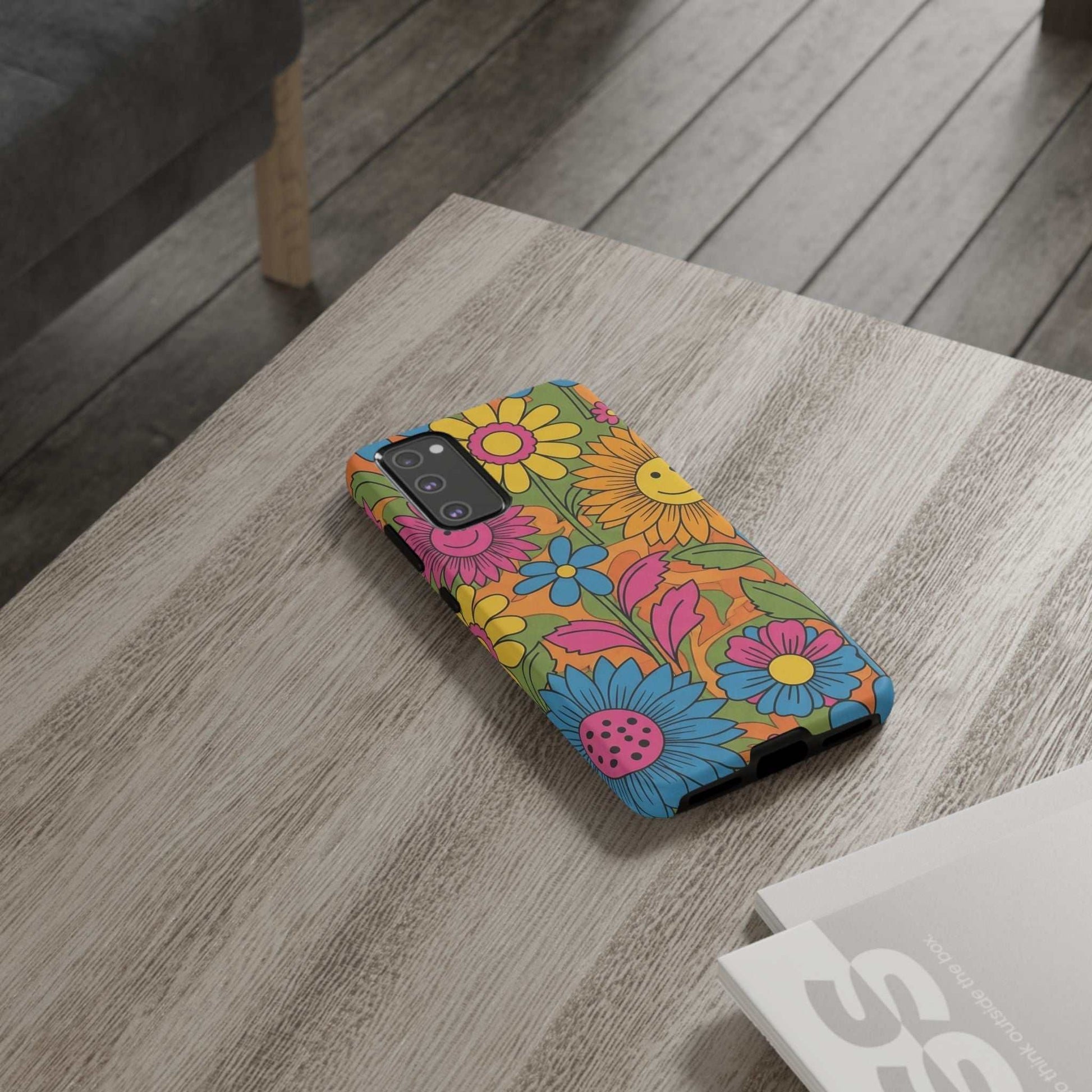 Samsung Phone Case with retro colorful flower power design on wooden table
