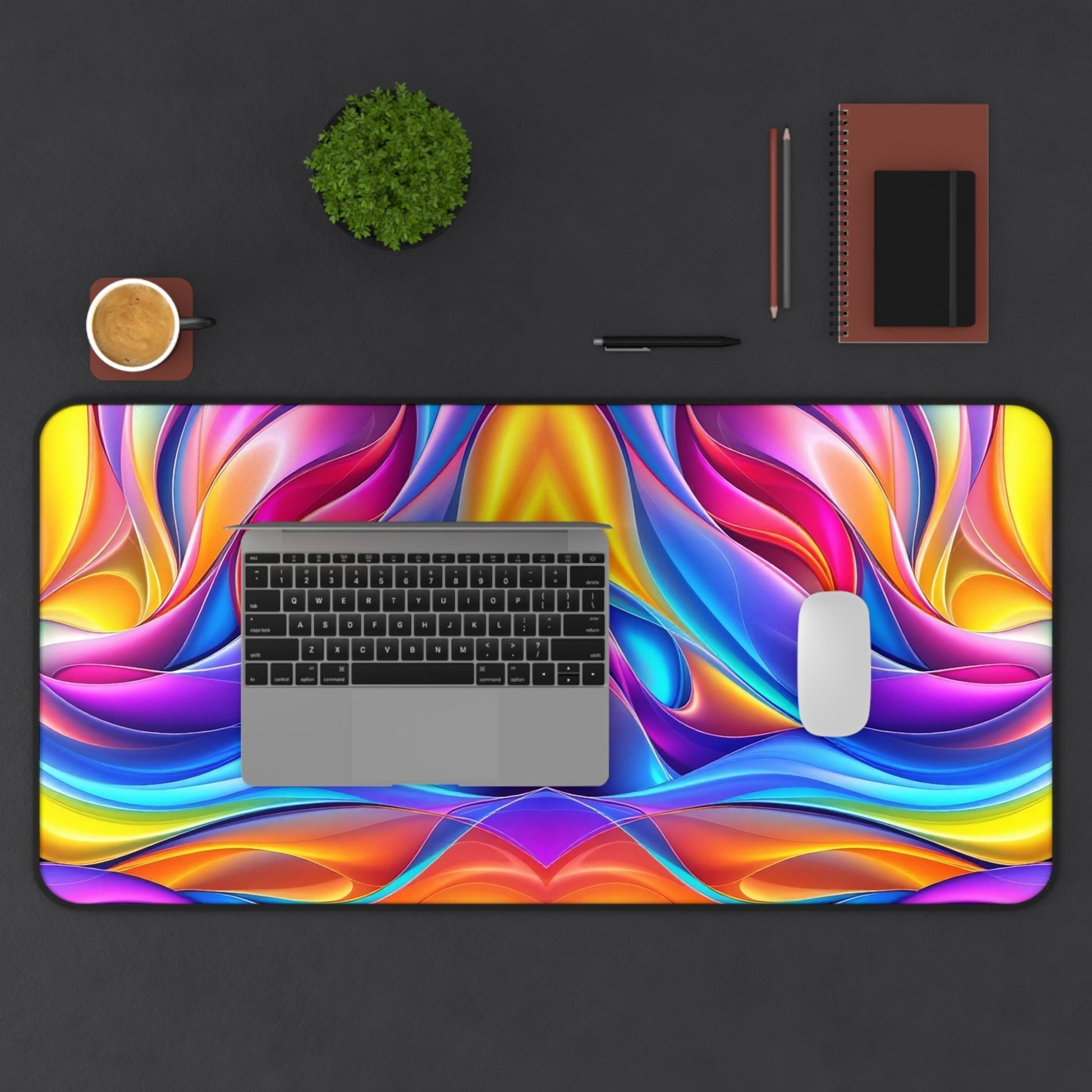 Modern Rainbow Waves desk mat with vibrant, colorful wave design and non-slip bottom on black desk with laptop and mouse