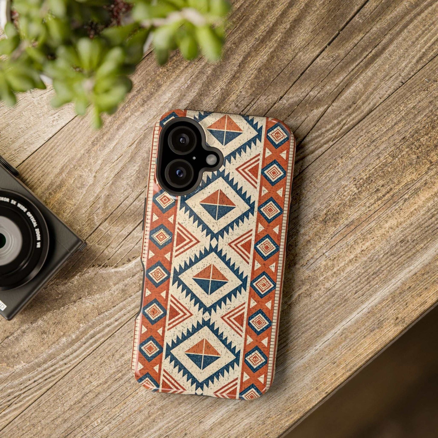iPhone case with tribal inspired pattern and magnetic tough protection on wooden surface