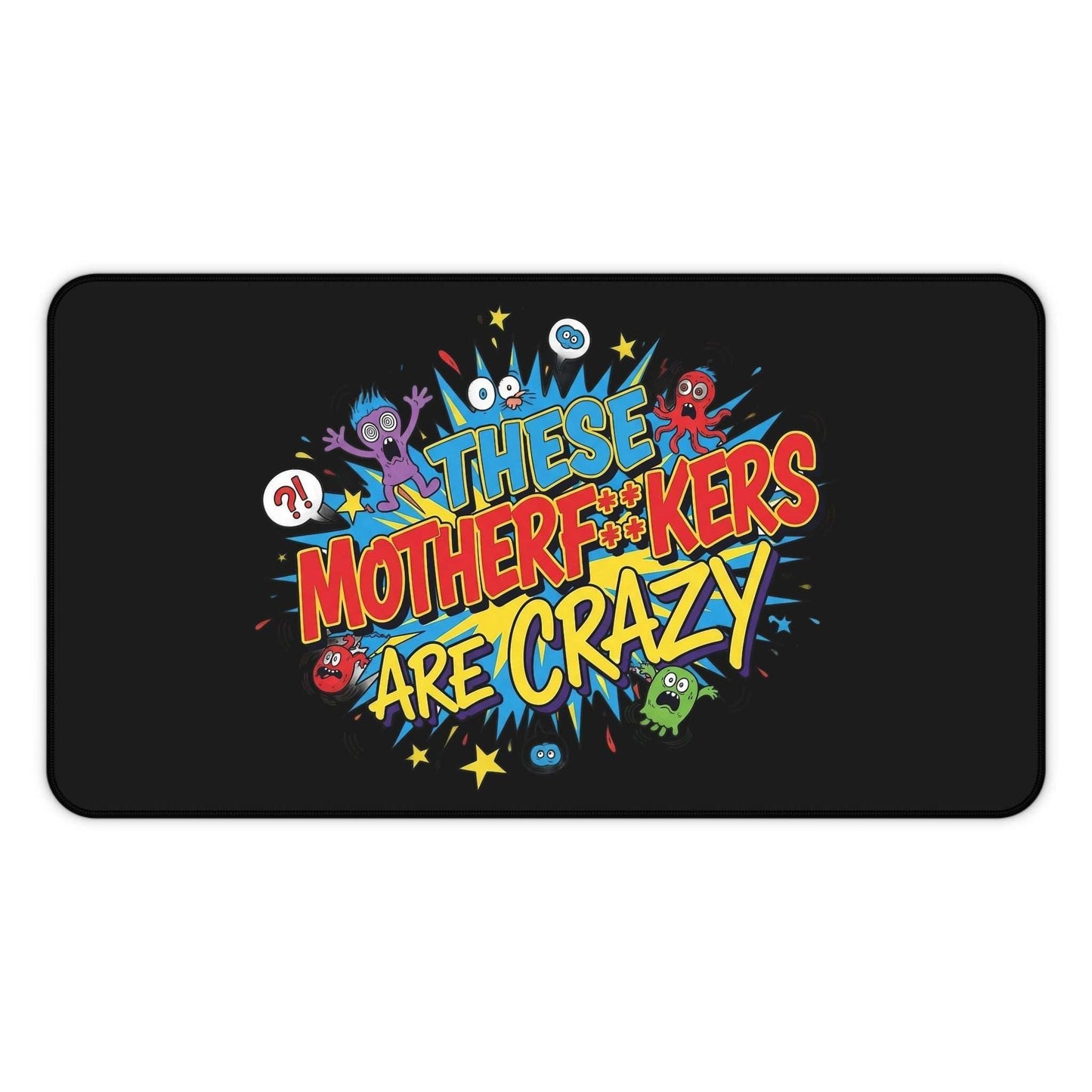 Funny black desk pad with colorful "These Motherf++kers Are Crazy" text and cartoon creatures, non-slip neoprene mat