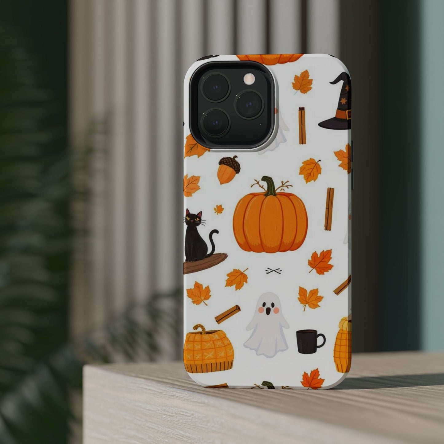 iPhone case with Halloween pumpkins, ghosts, black cat, and autumn leaves design
