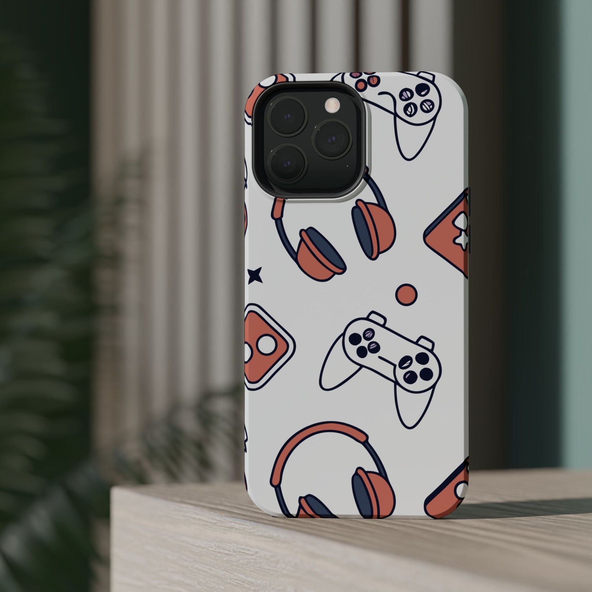 Gamer iPhone tough case with colorful gaming controller and headset design, durable polycarbonate and TPU protection with MagSafe compatibility.