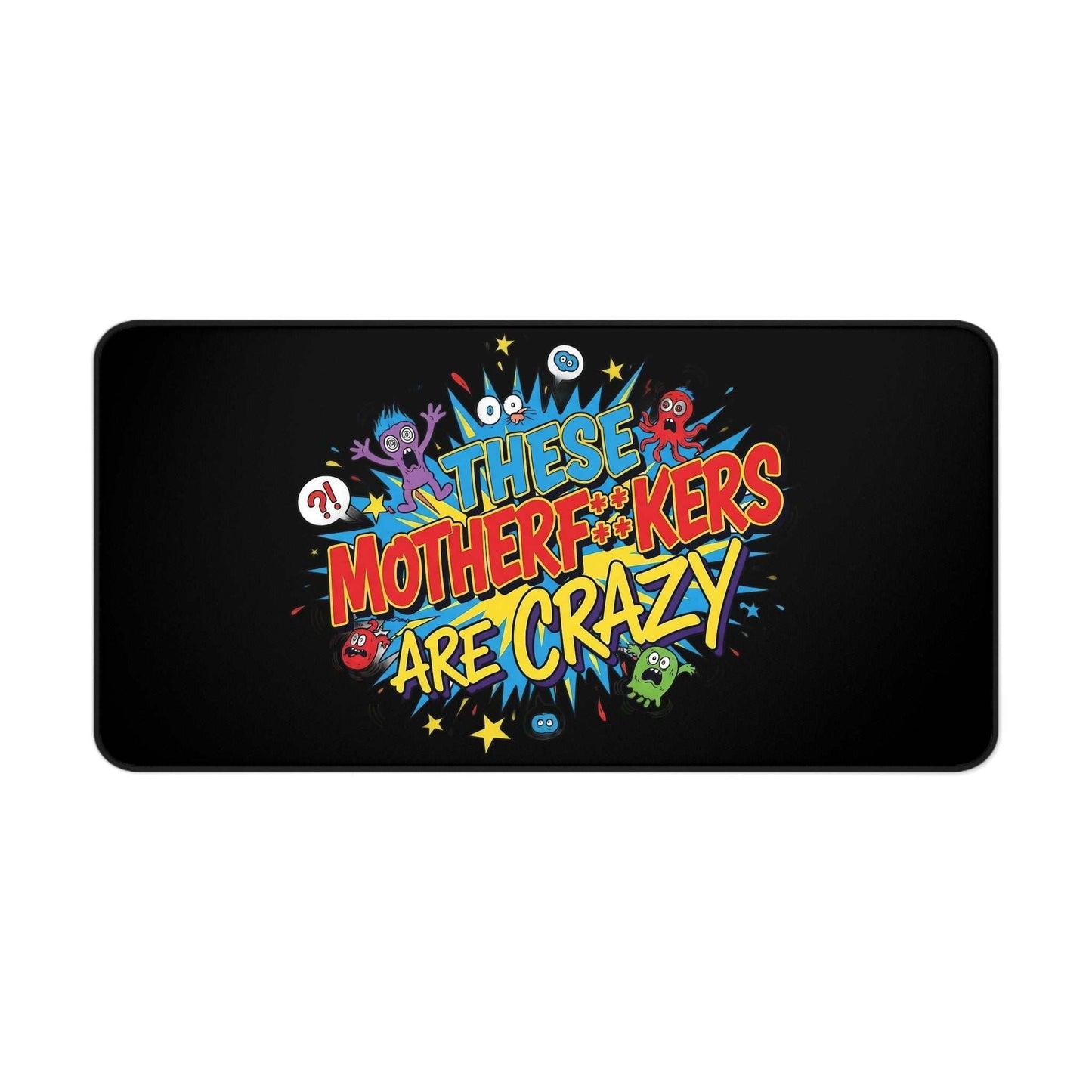 Black desk pad with colorful bold text "These Motherf++kers Are Crazy" and cartoon characters, non-slip and durable neoprene office mat