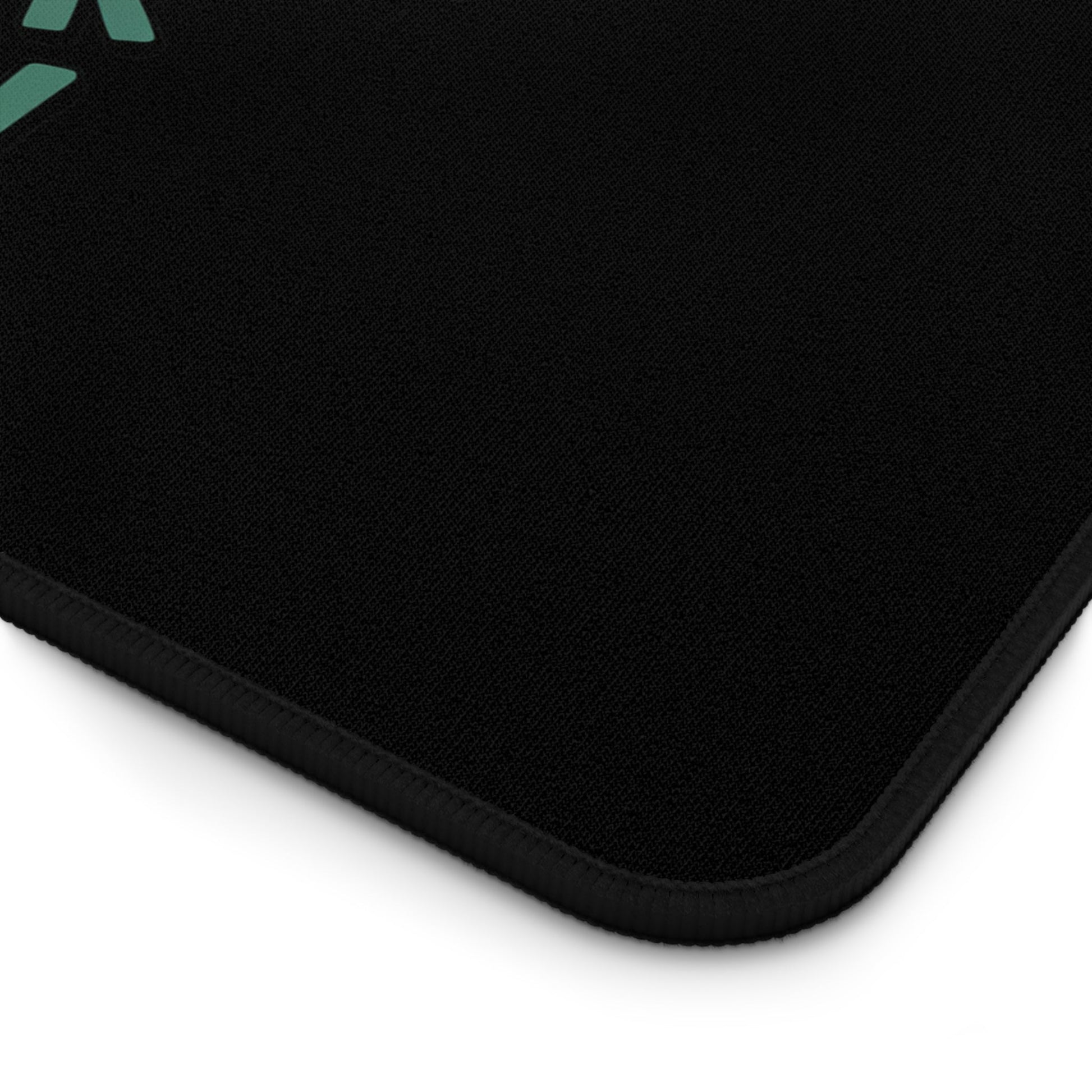 Black desk mat corner with hemmed edges designed with funny Santa checking browser history theme