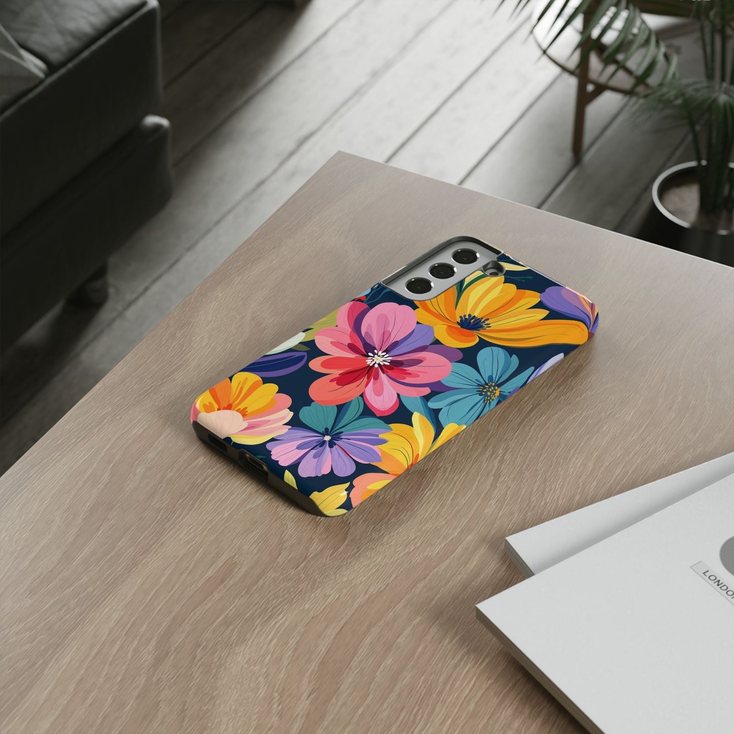Colorful Floral Samsung Phone Case with vibrant flower design and shock-absorbing silicone liner on wooden table