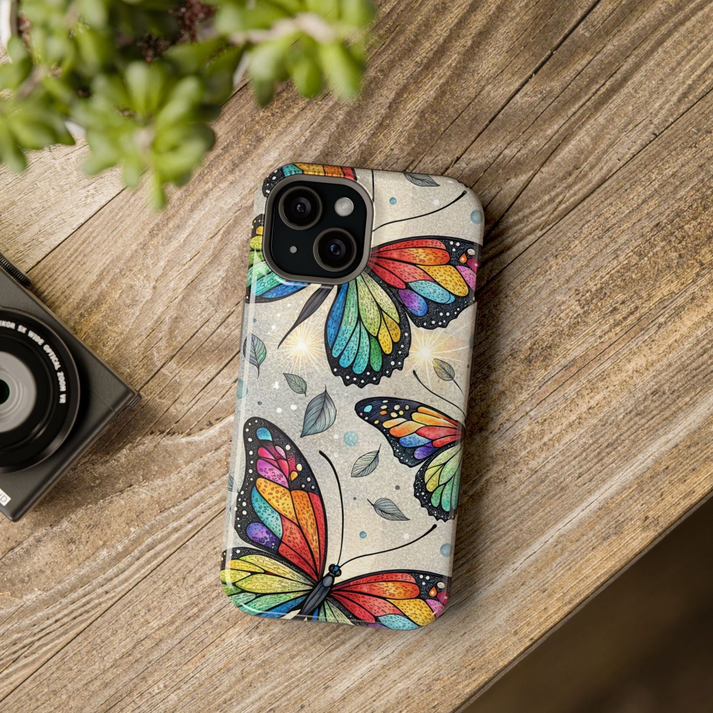 Vibrant Rainbow Butterfly iPhone case with colorful butterfly design and tough dual-layer protection on wooden surface