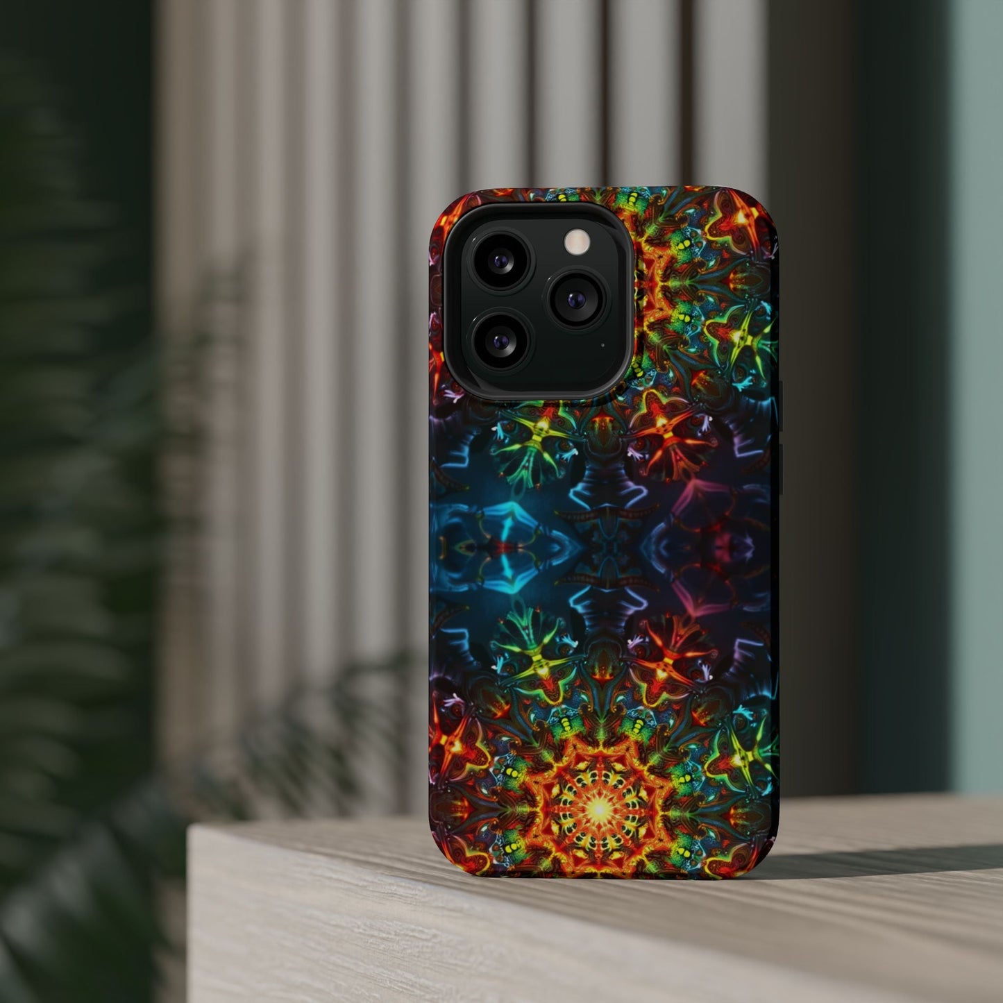 iPhone case with vibrant abstract kaleidoscope design, durable dual-layer protection, and MagSafe compatibility