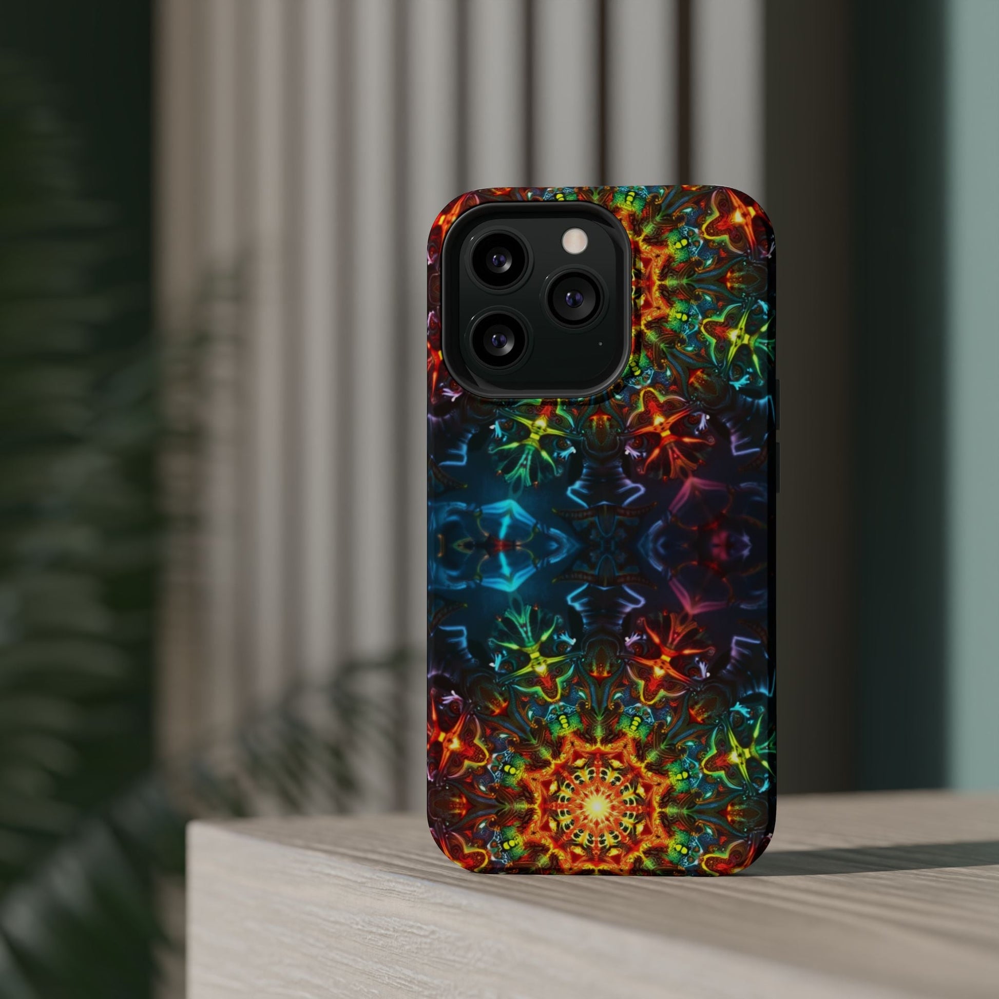 iPhone case with vibrant abstract kaleidoscope design, durable dual-layer protection, and MagSafe compatibility