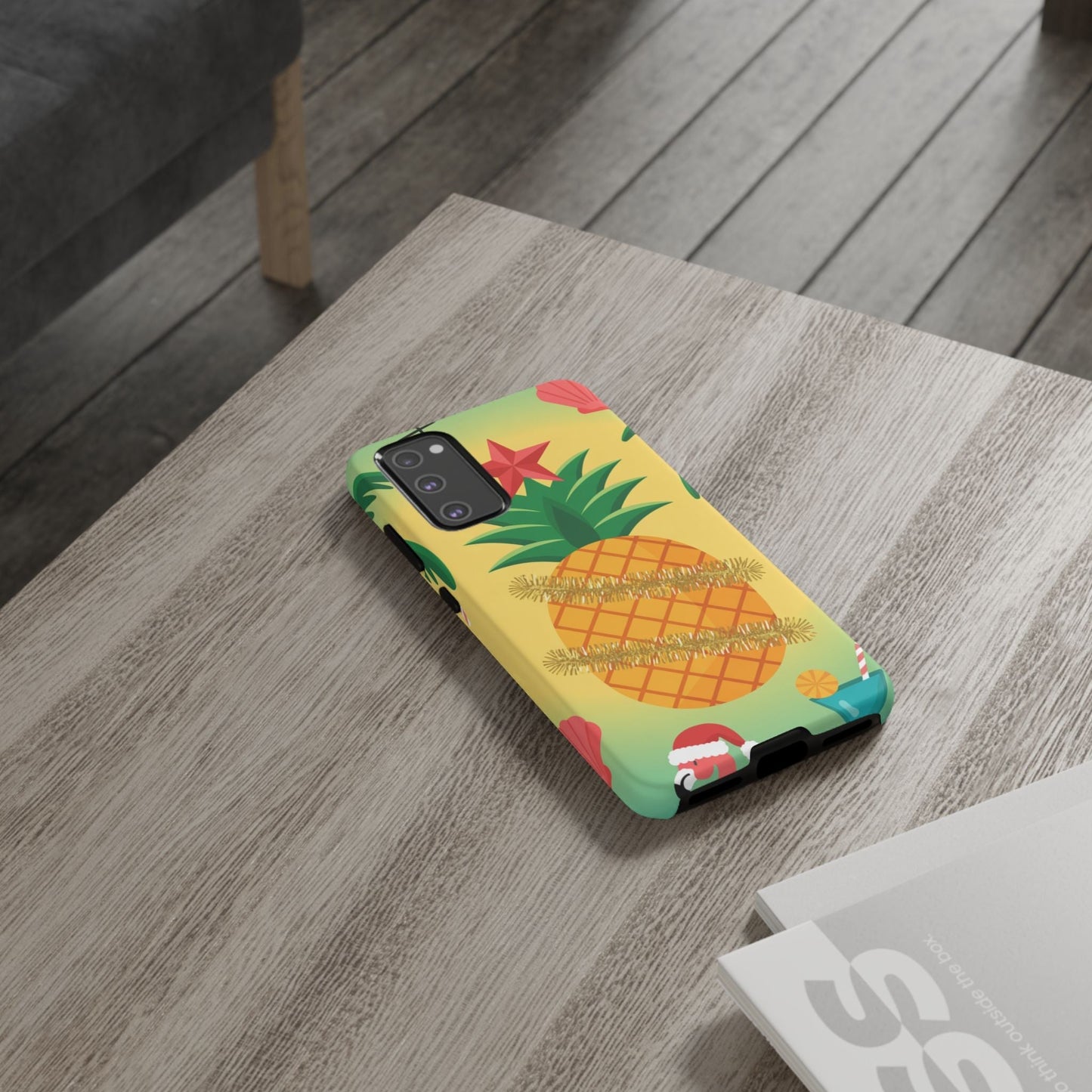 Samsung Christmas Pineapple phone case with festive tropical design on wooden table