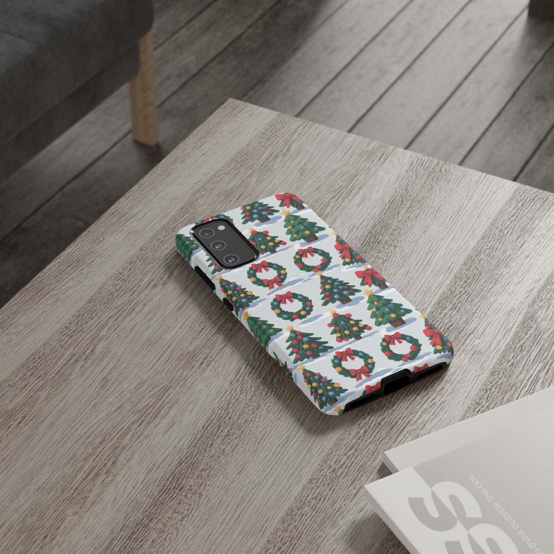 Samsung phone case with holiday wreath and tree pattern on wooden table, festive Christmas design, durable protective cover
