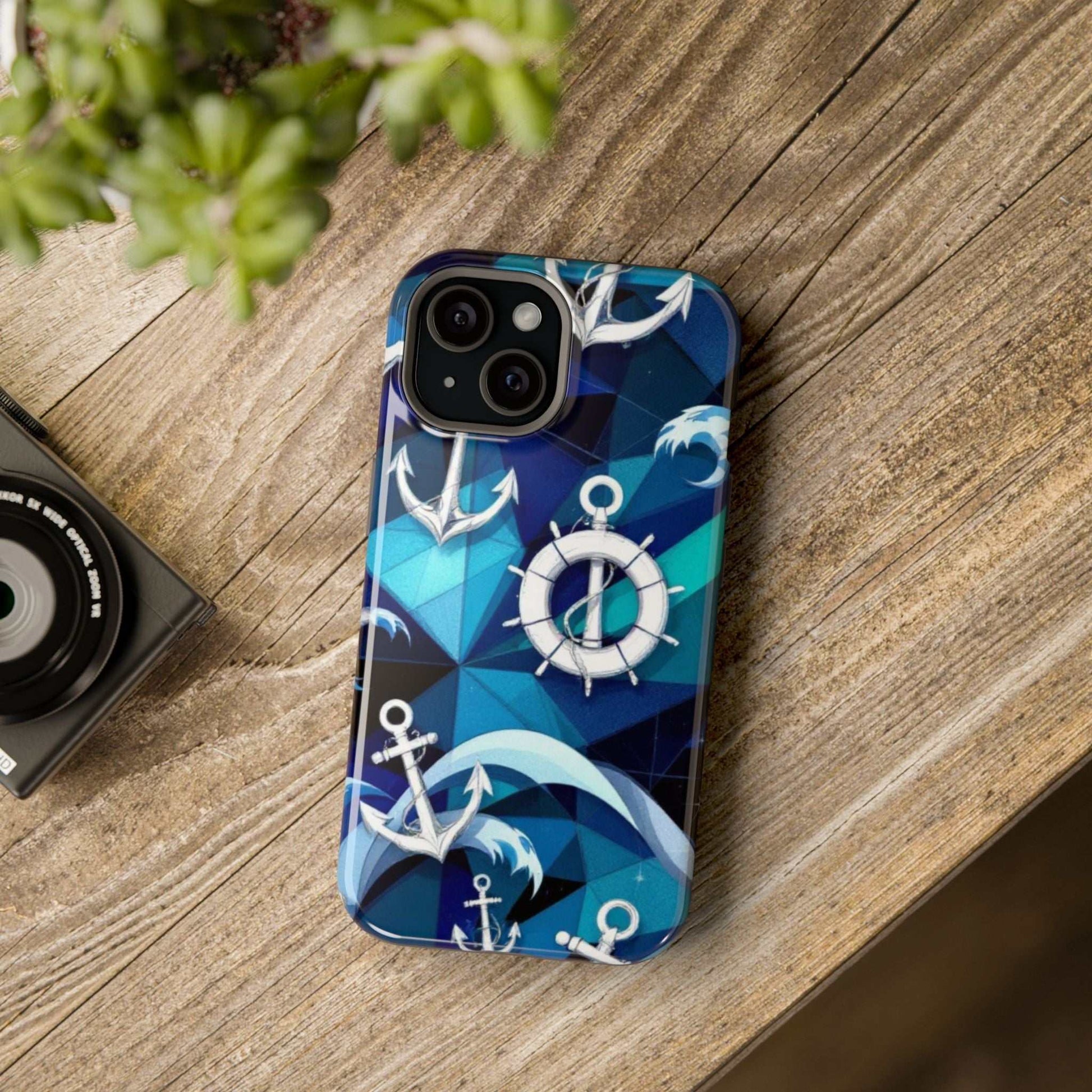 Nautical Anchors iPhone case with maritime design and MagSafe compatibility on wooden surface