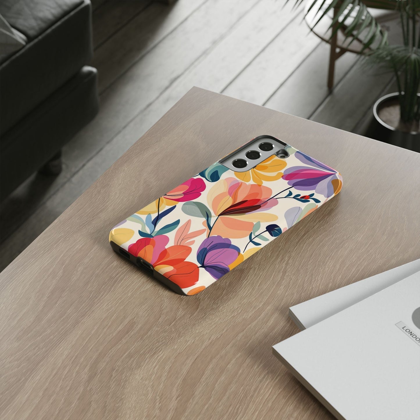 Watercolor floral Samsung tough case with vibrant flowers and durable protective design on a wooden table