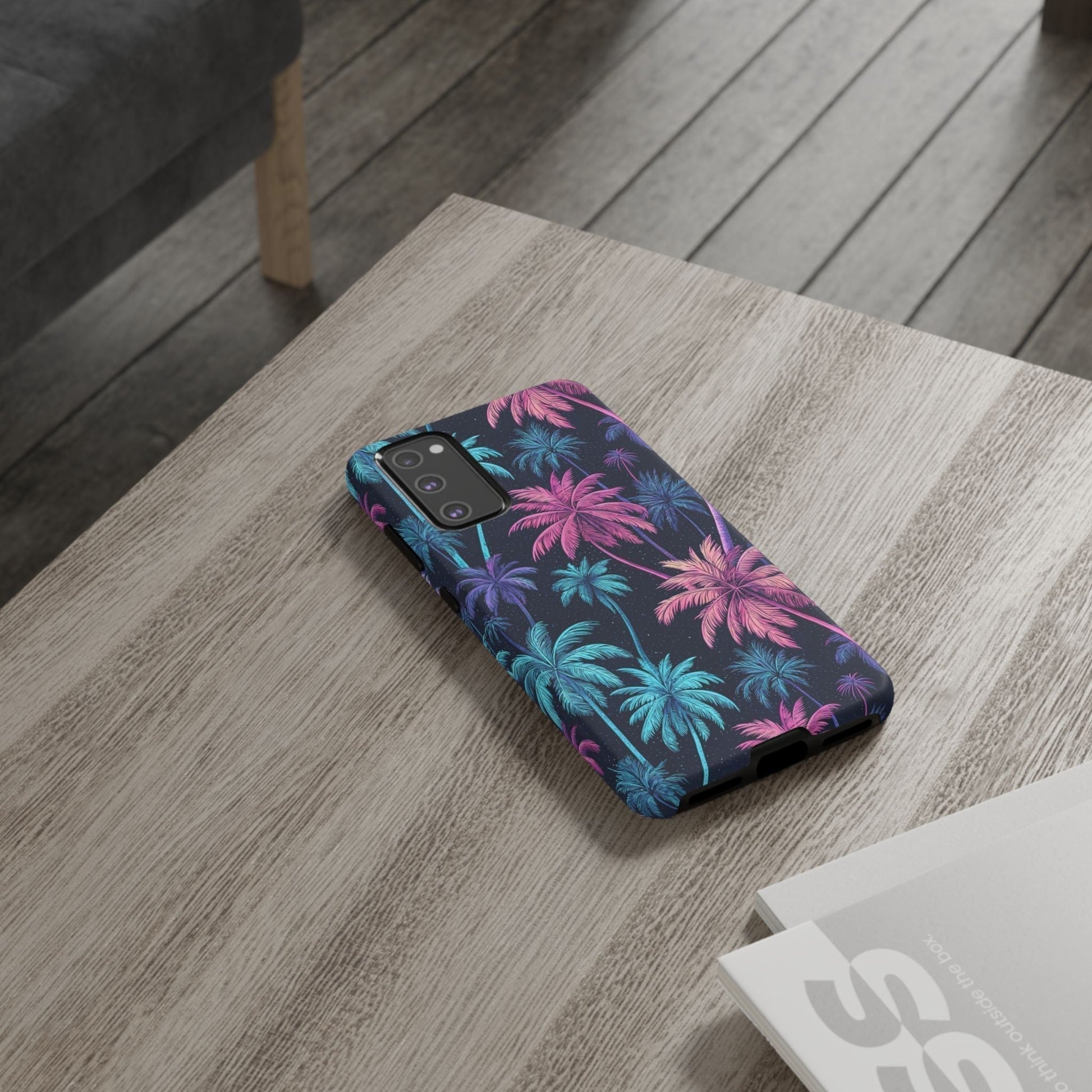 Neon Palm Tree phone case with colorful tropical palm design on durable Samsung cover placed on wooden table