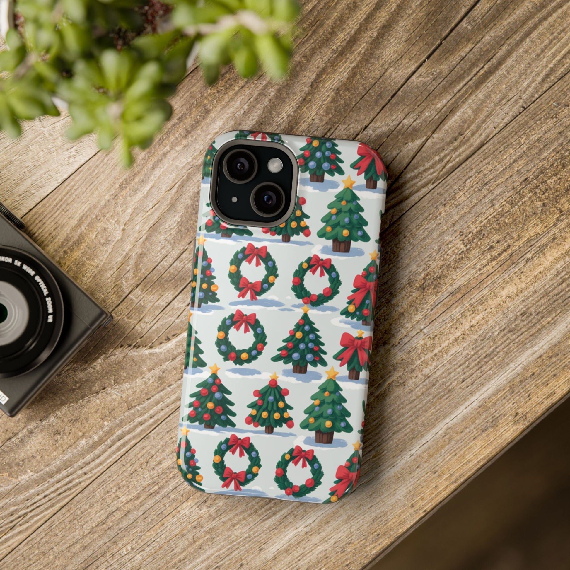 iPhone case with festive holiday tree and wreath pattern in vibrant colors for Christmas celebration