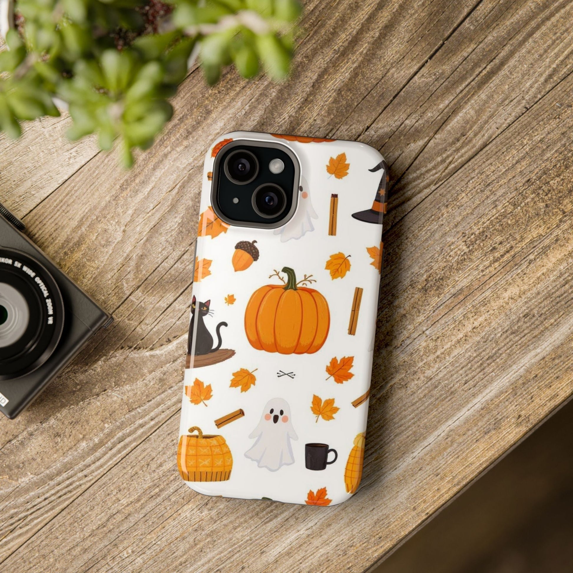iPhone case with Halloween pumpkins, ghosts, leaves, and spooky design for festive phone protection
