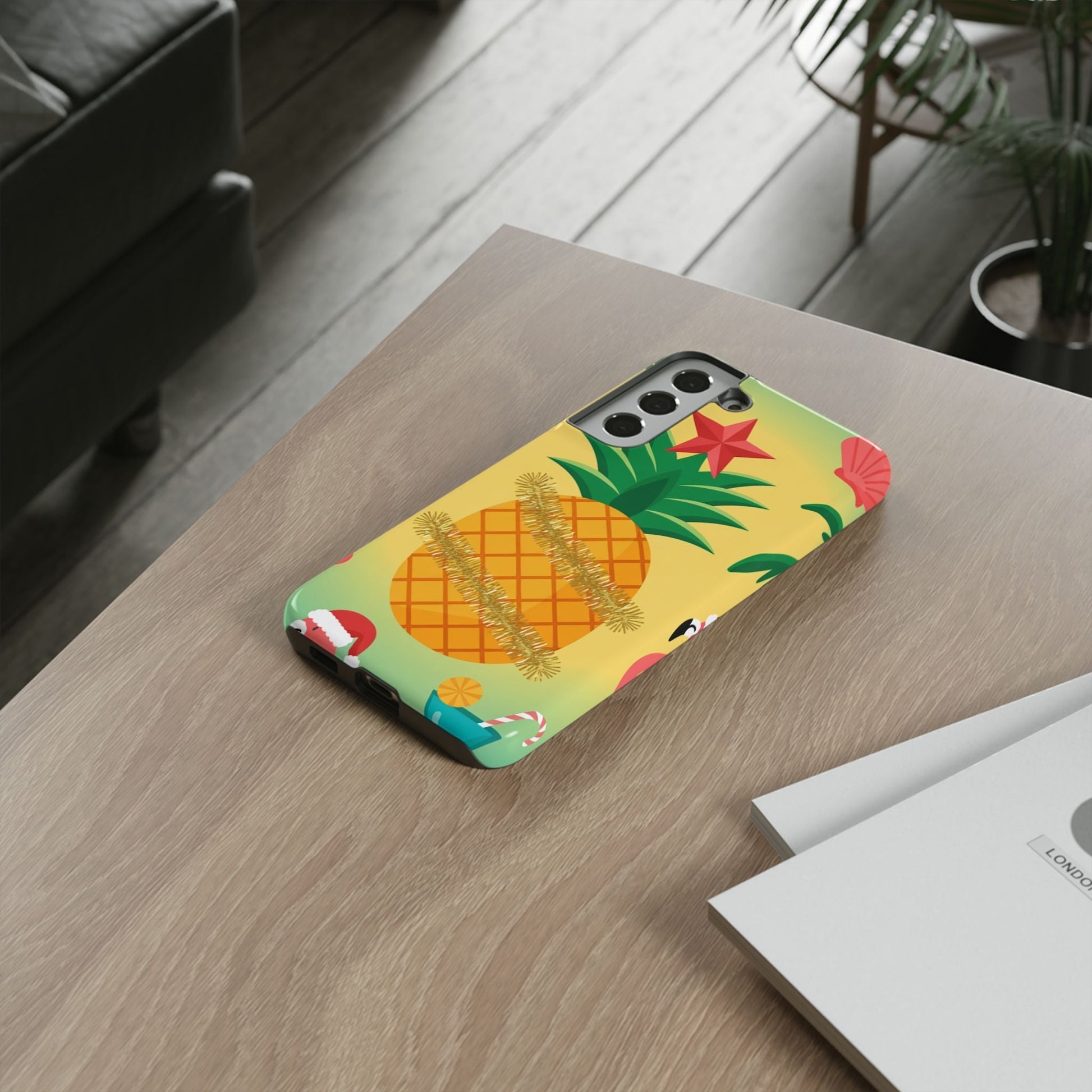 Samsung Christmas Pineapple phone case with festive pineapple design on wooden table