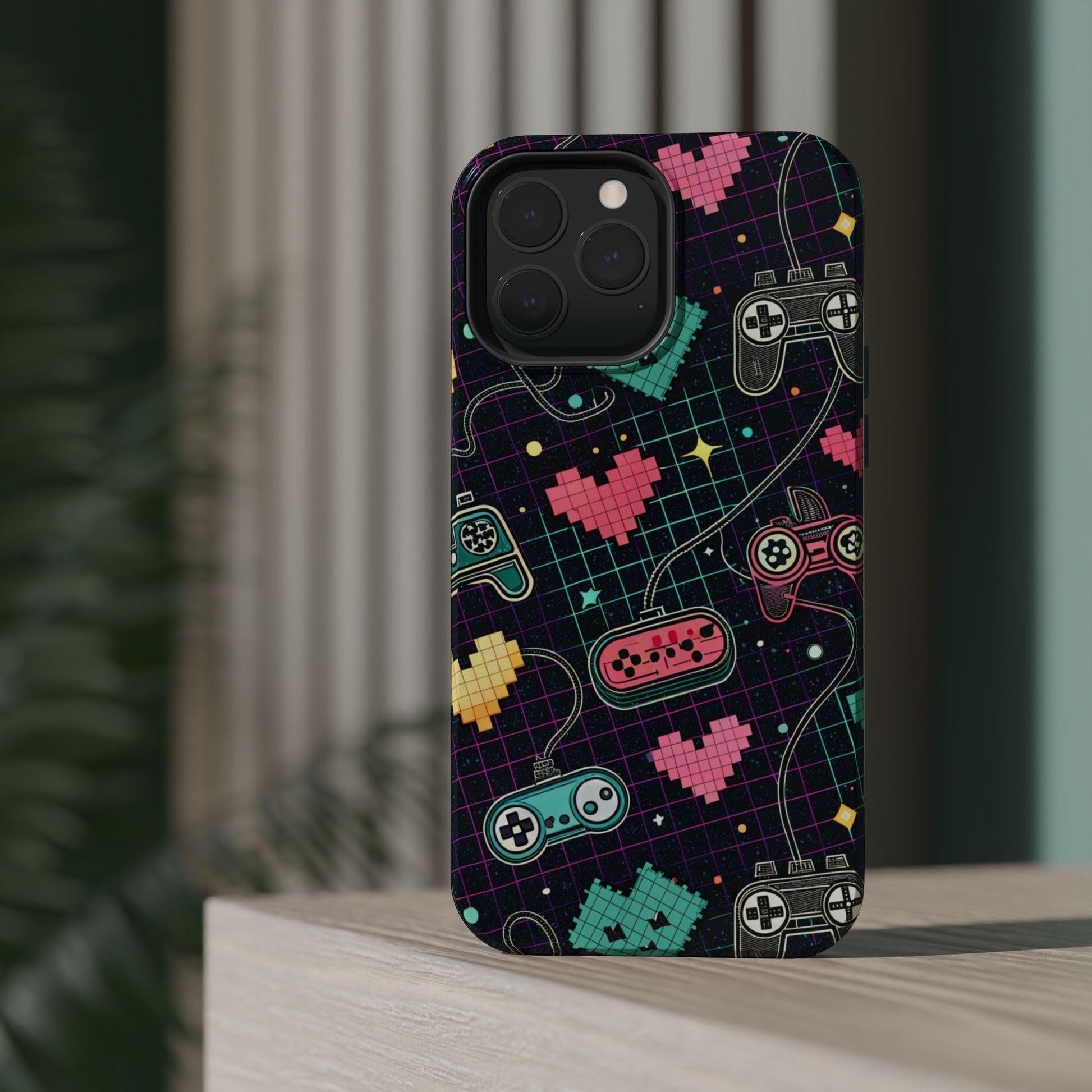Retro gamer inspired iPhone case with colorful pixelated hearts and classic game controllers design, durable dual-layer protection with MagSafe compatibility.