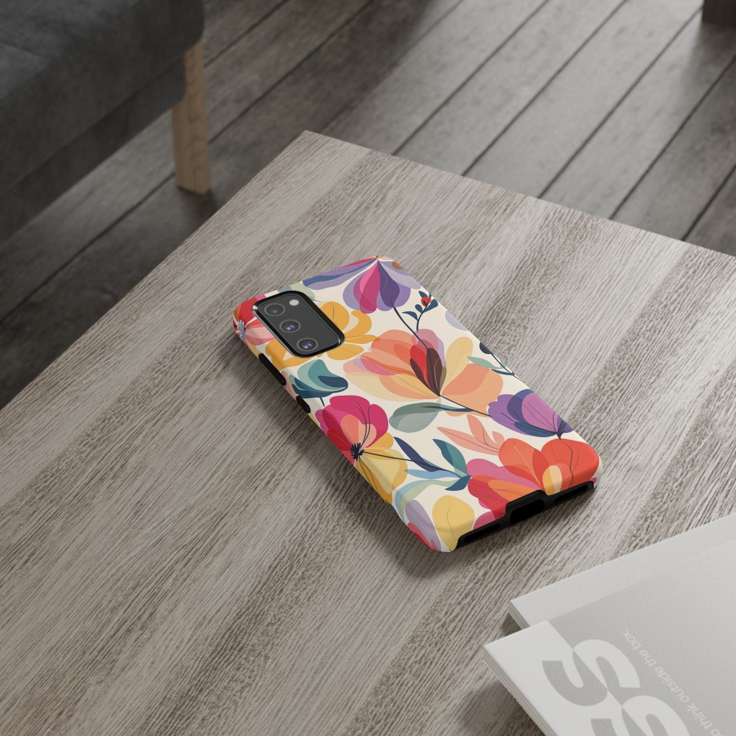 Watercolor floral Samsung tough phone case with durable shock-absorbing design and vibrant colors on wooden table