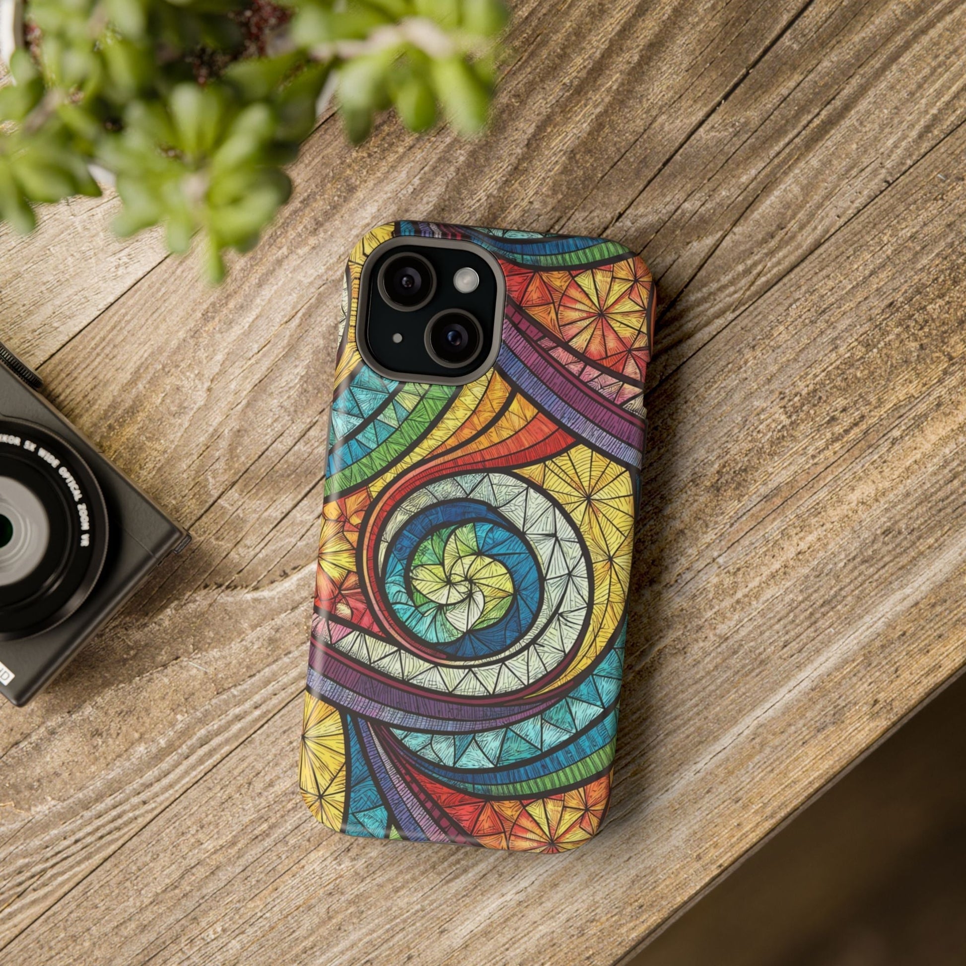 Stained glass inspired rainbow swirl iPhone case with vibrant artistic design and protective dual-layer build with MagSafe compatibility