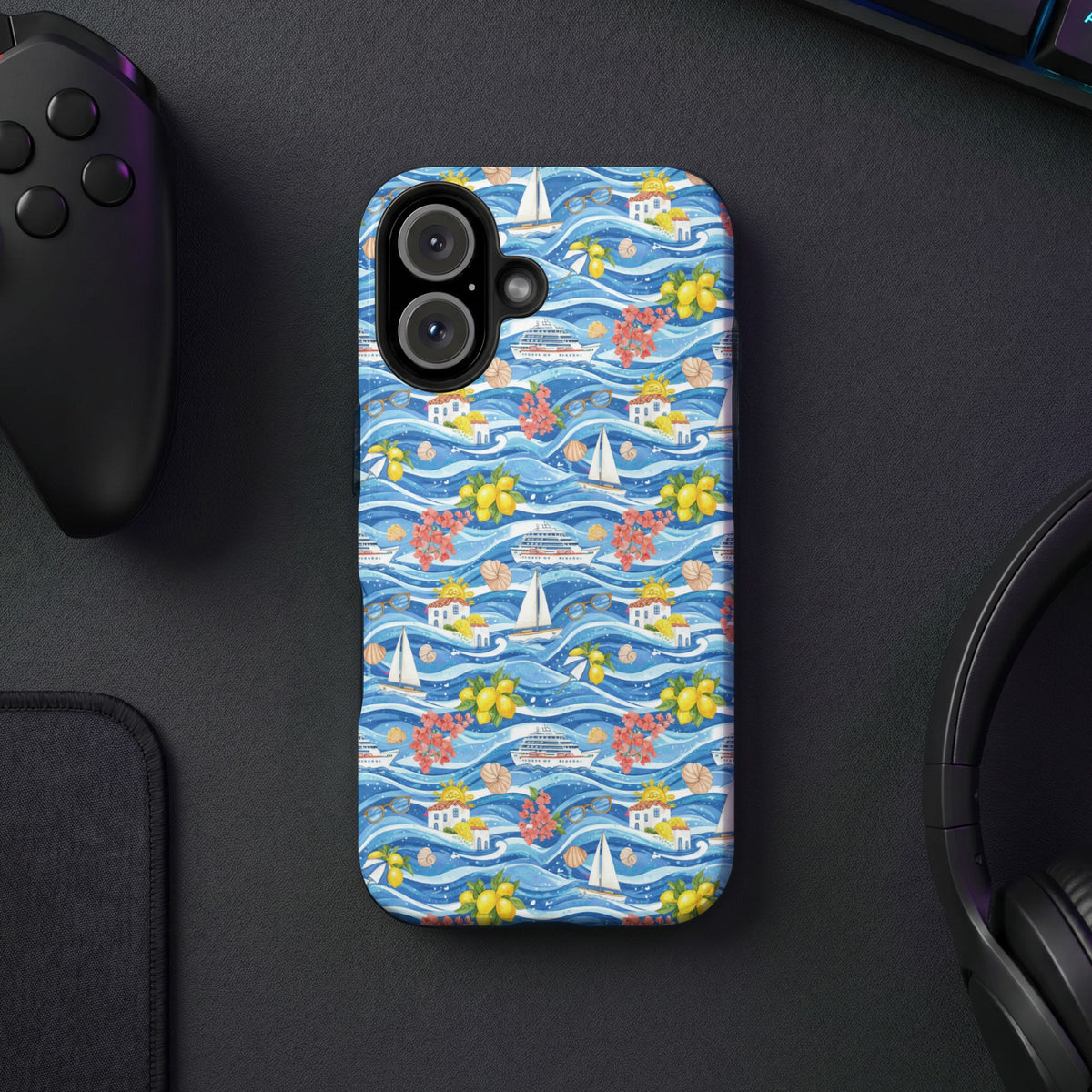 Phone case with a coastal pattern of waves, sailboats, cruise ships, lemons, and houses.