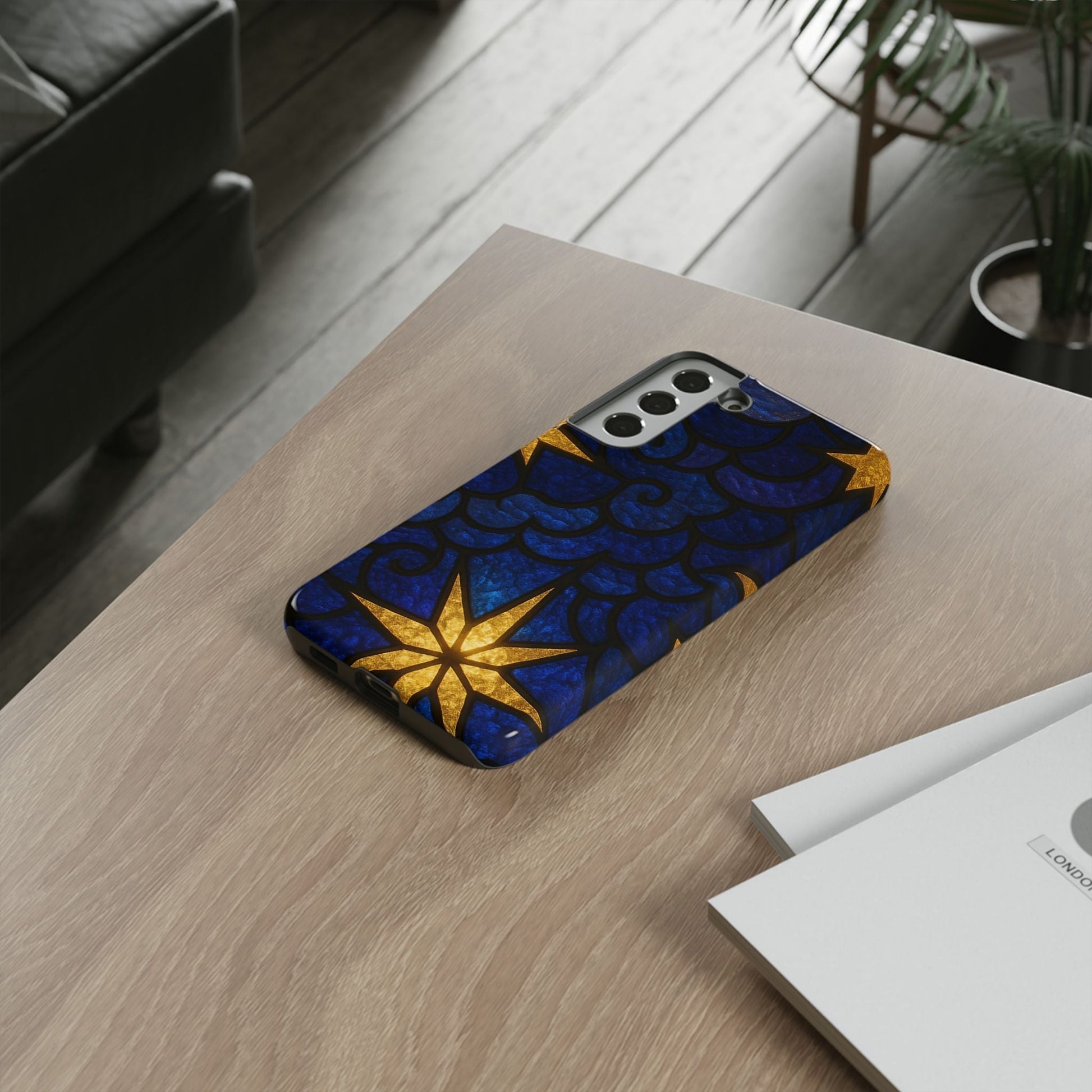 Samsung phone case with golden star design and blue textured background for durable protection