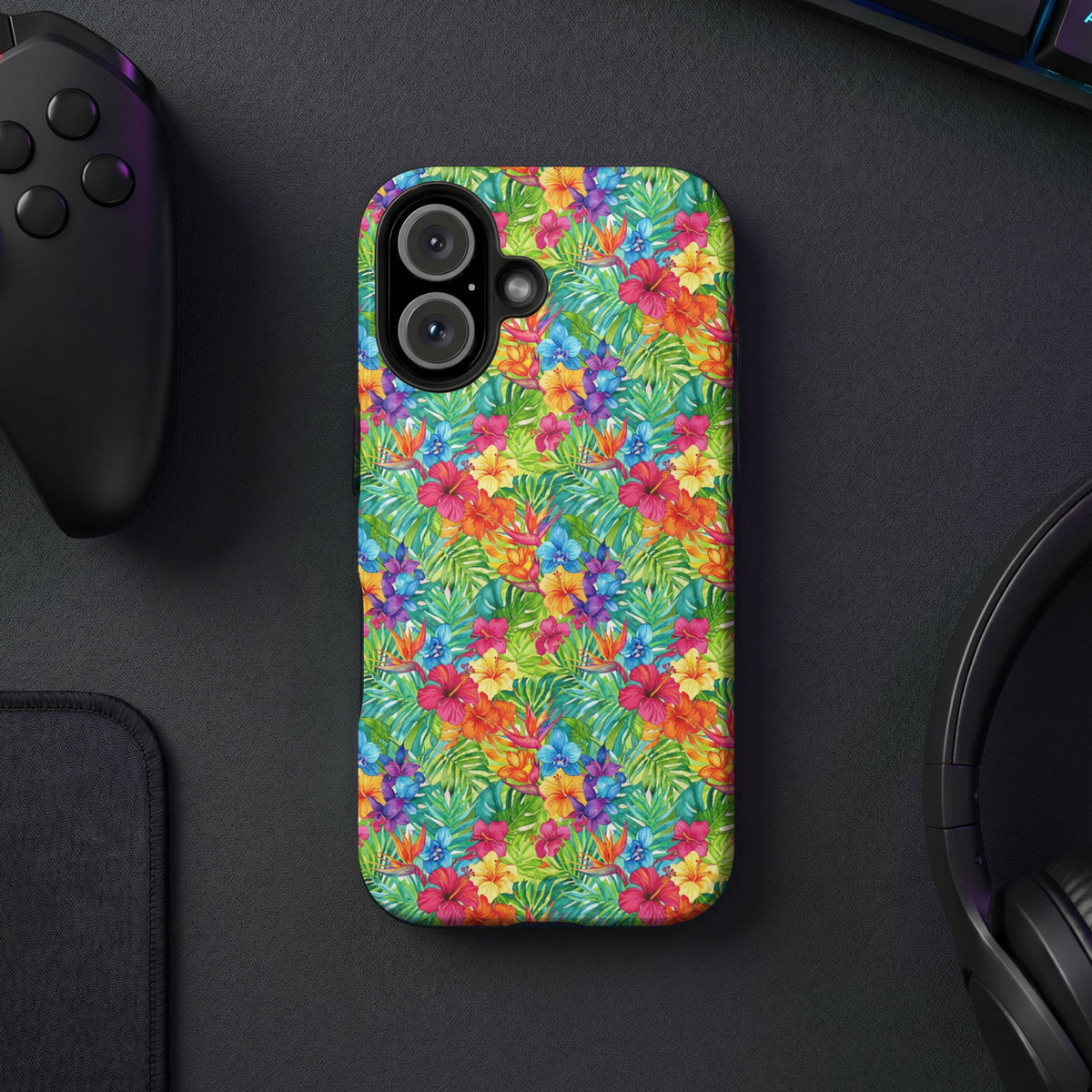 Phone case with a vibrant tropical floral and leaf pattern.