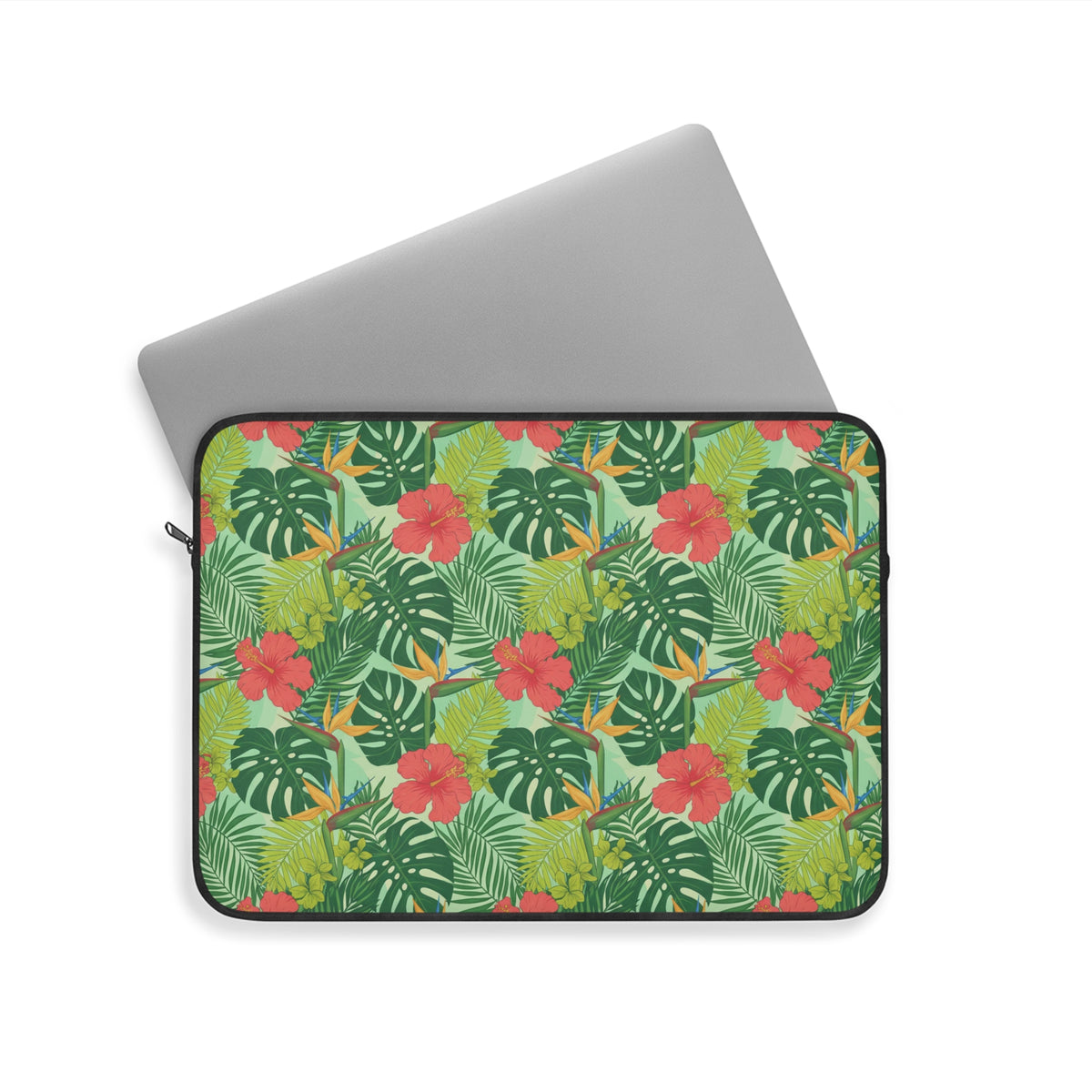 Laptop sleeve with tropical pattern of leaves and red, yellow, and blue flowers.