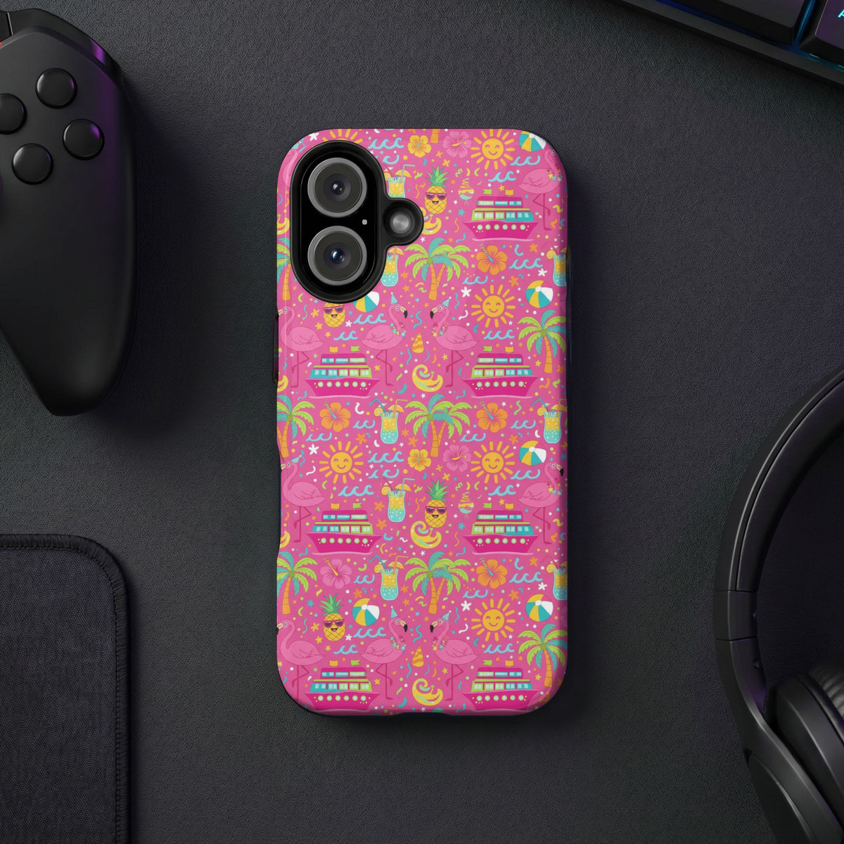 Pink phone case with a colorful summer pattern featuring flamingos, cruise ships, and cocktails.