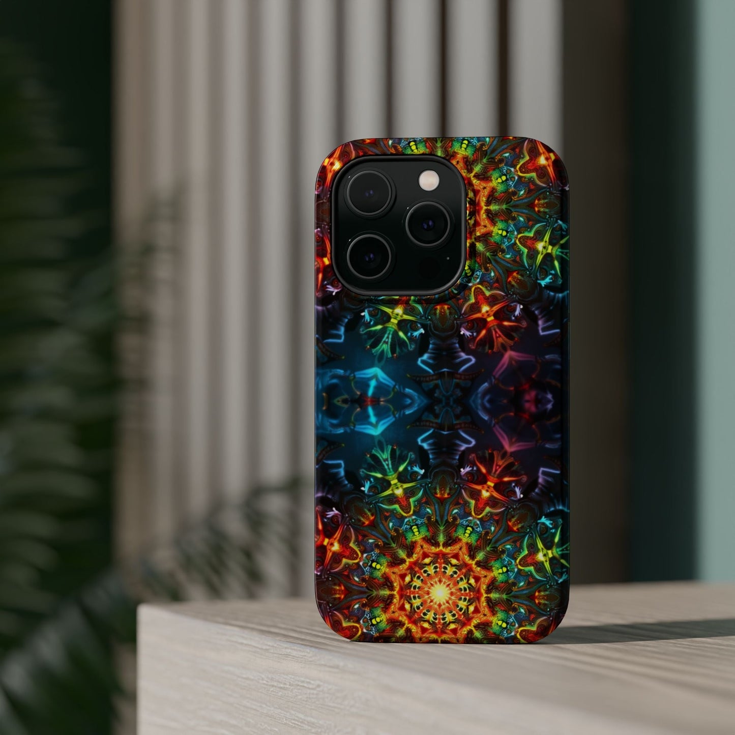 iPhone case with vibrant abstract kaleidoscope design and durable protective dual-layer build