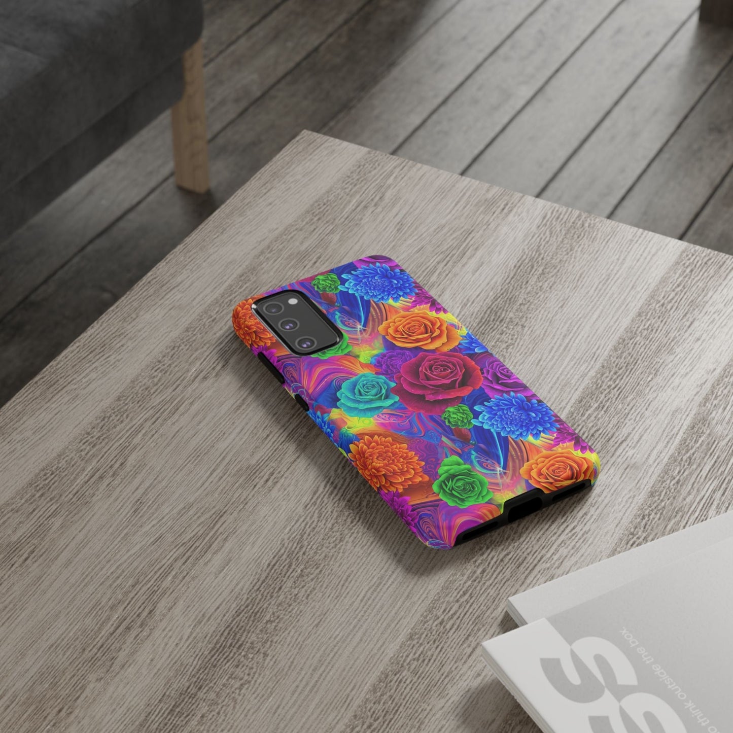 Vibrant floral Samsung phone case with colorful rose pattern and durable protective design on wooden table