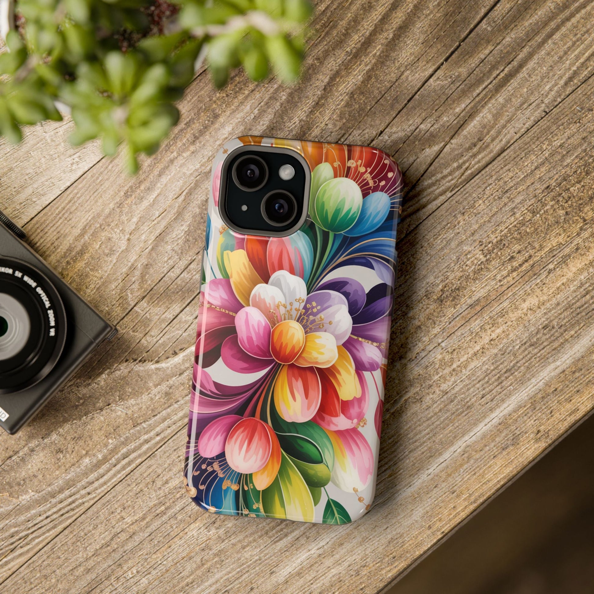 Vibrant Floral iPhone Case with colorful floral design and dual-layer protection on wooden surface