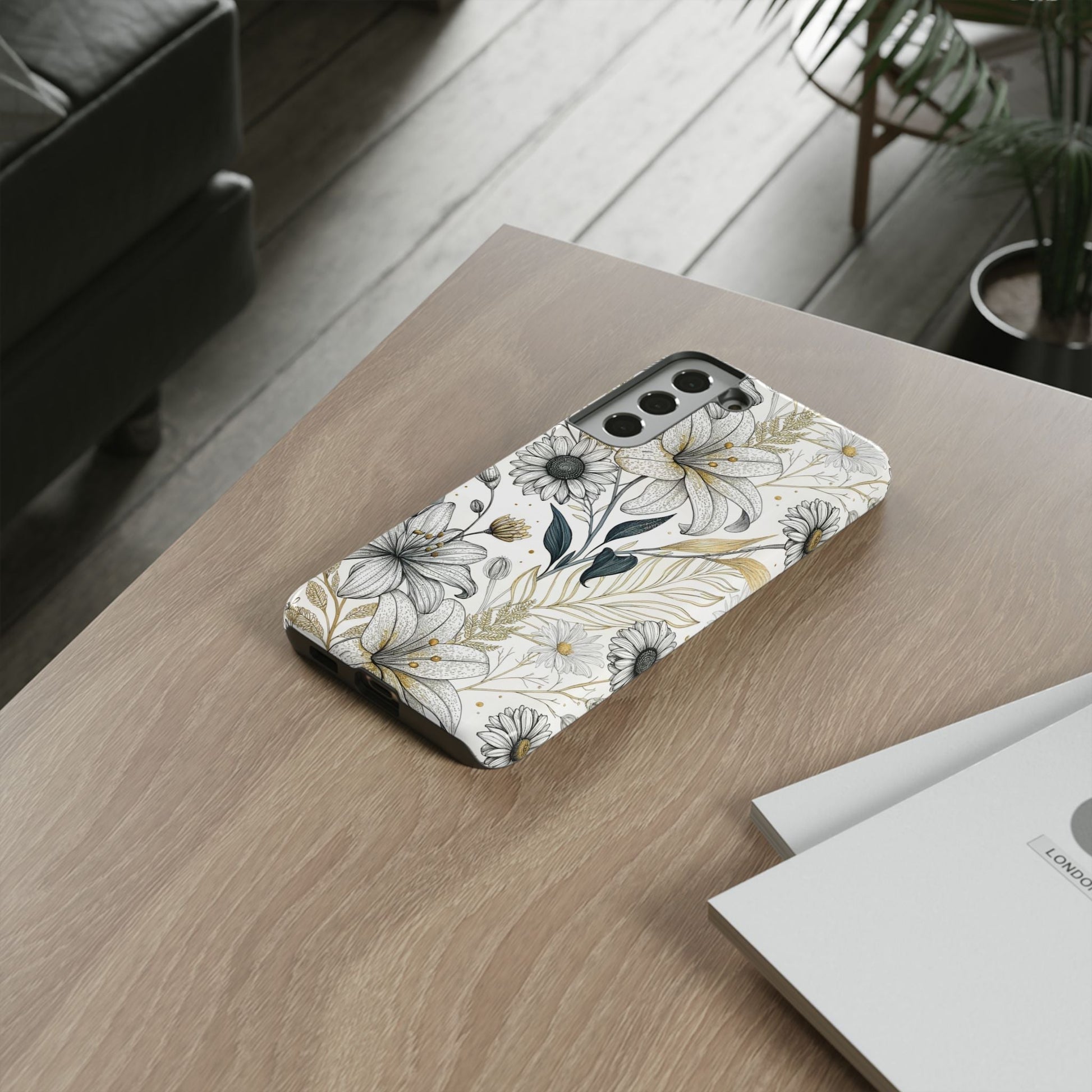 Golden leaf minimalist Samsung tough phone case with floral design on wooden table