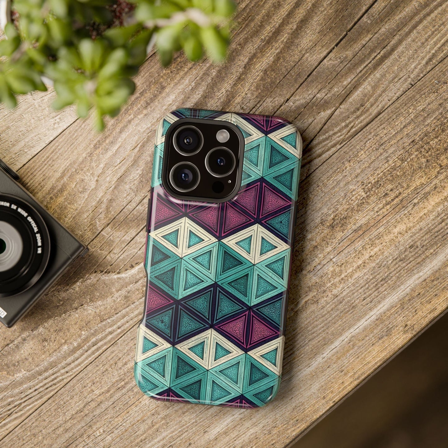 Purple and teal abstract geometric magnetic iPhone tough case with MagSafe compatibility on wooden surface