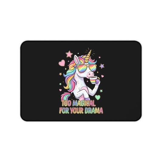 Whimsical unicorn desk mat with colorful design and "Too Magical For Your Drama" text on black neoprene surface