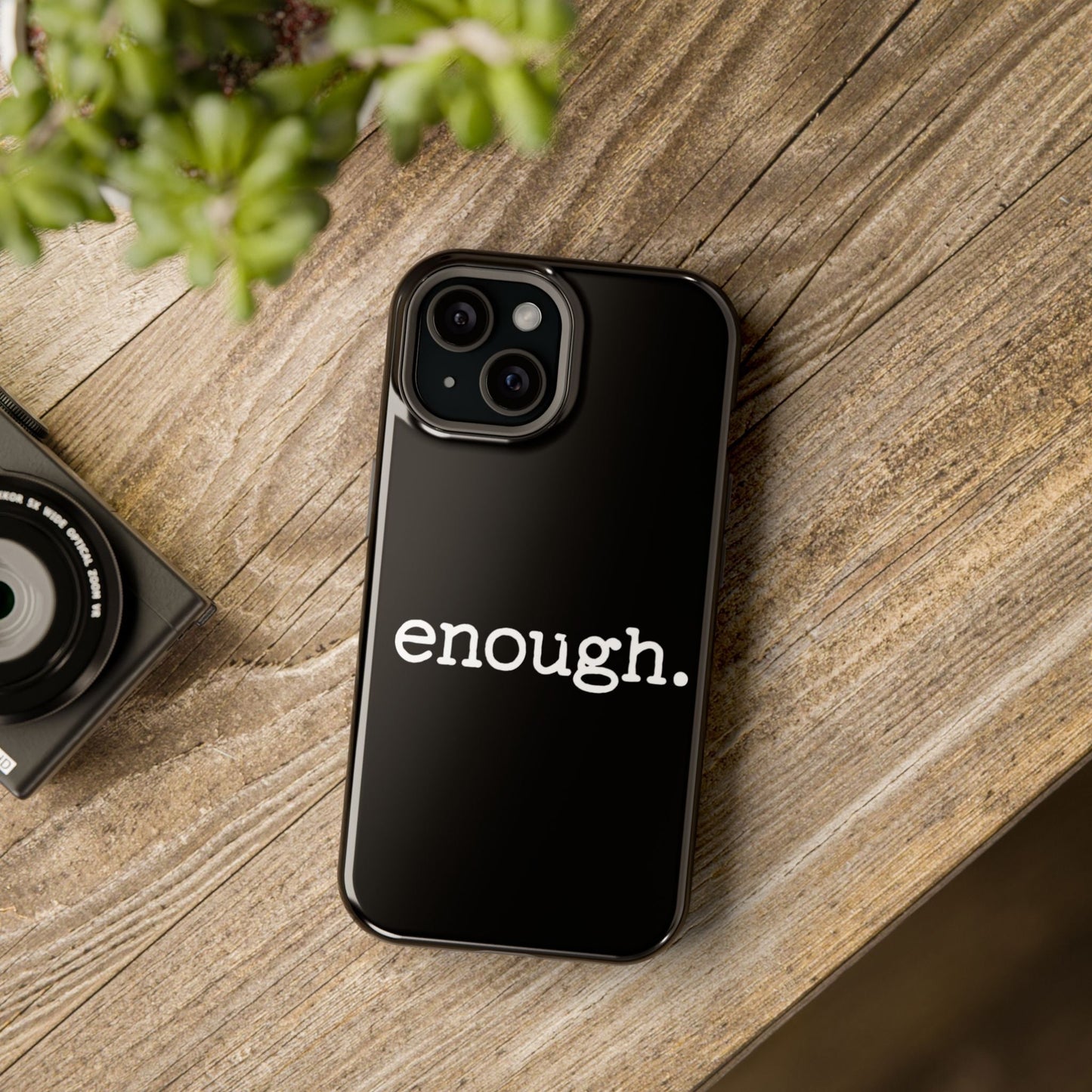 Black iPhone case with "enough." protest statement design and MagSafe compatibility