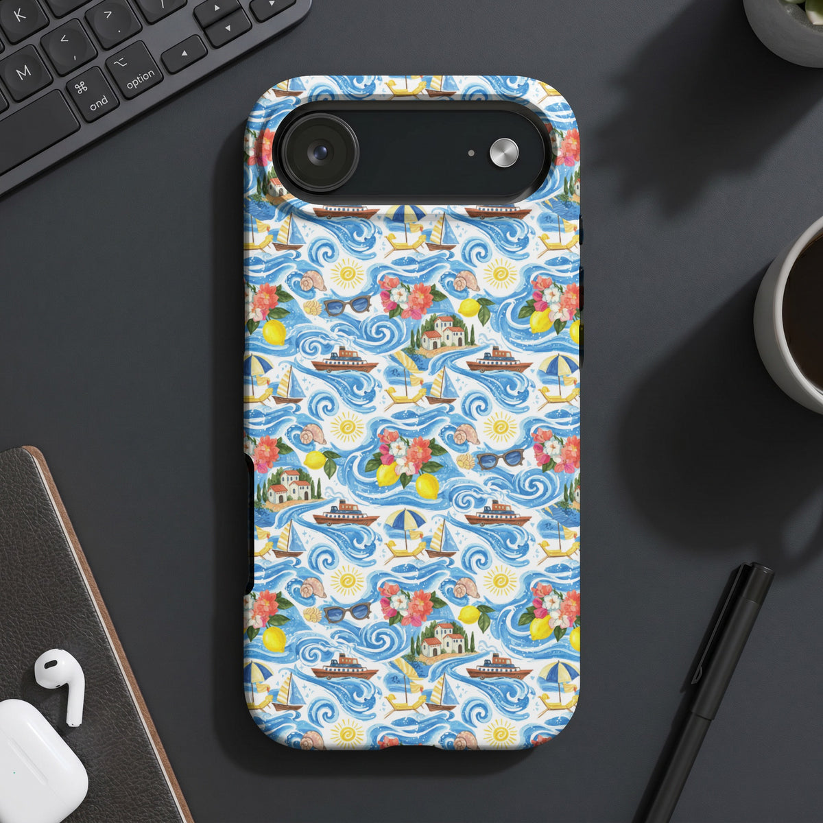 Phone case with a seaside village, sailboats, and waves pattern.