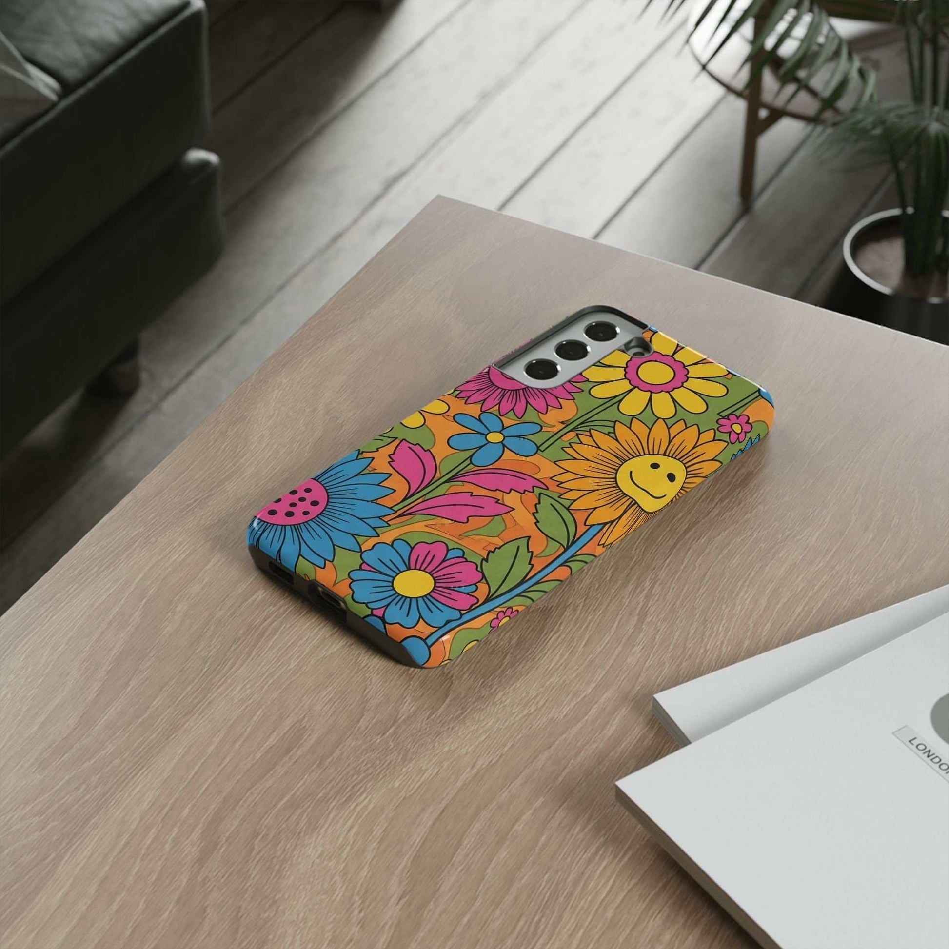 Samsung Phone Case with colorful retro flower power design on wooden table