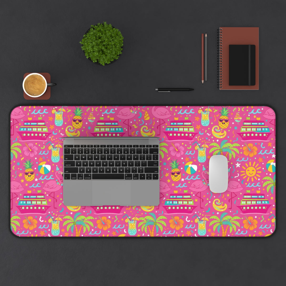 Desk mat with a pink tropical pattern of cruise ships, flamingos, pineapples, and cocktails.
