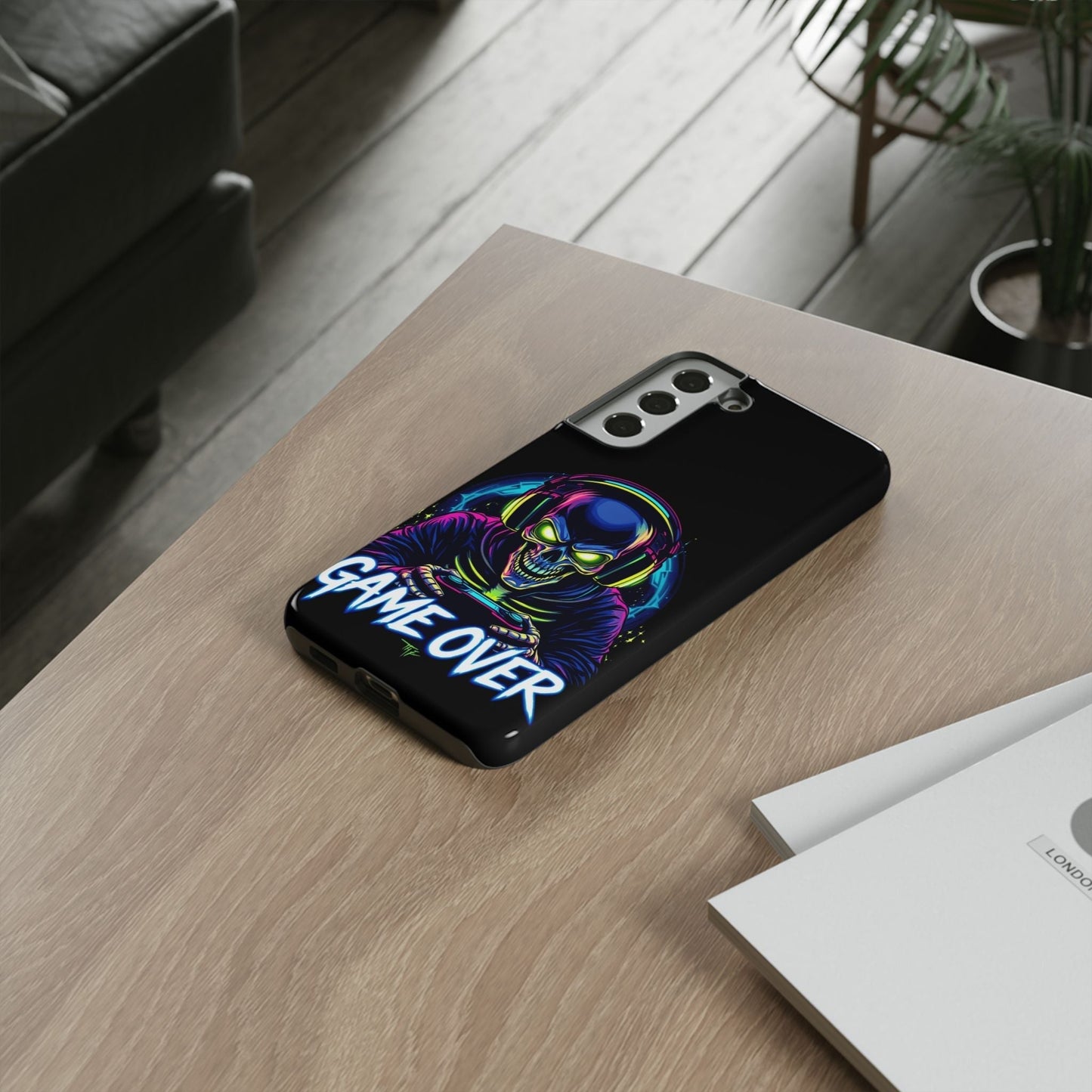 Samsung phone case with durable impact-resistant Game Over Design featuring a colorful skull gamer graphic and bold text on black background